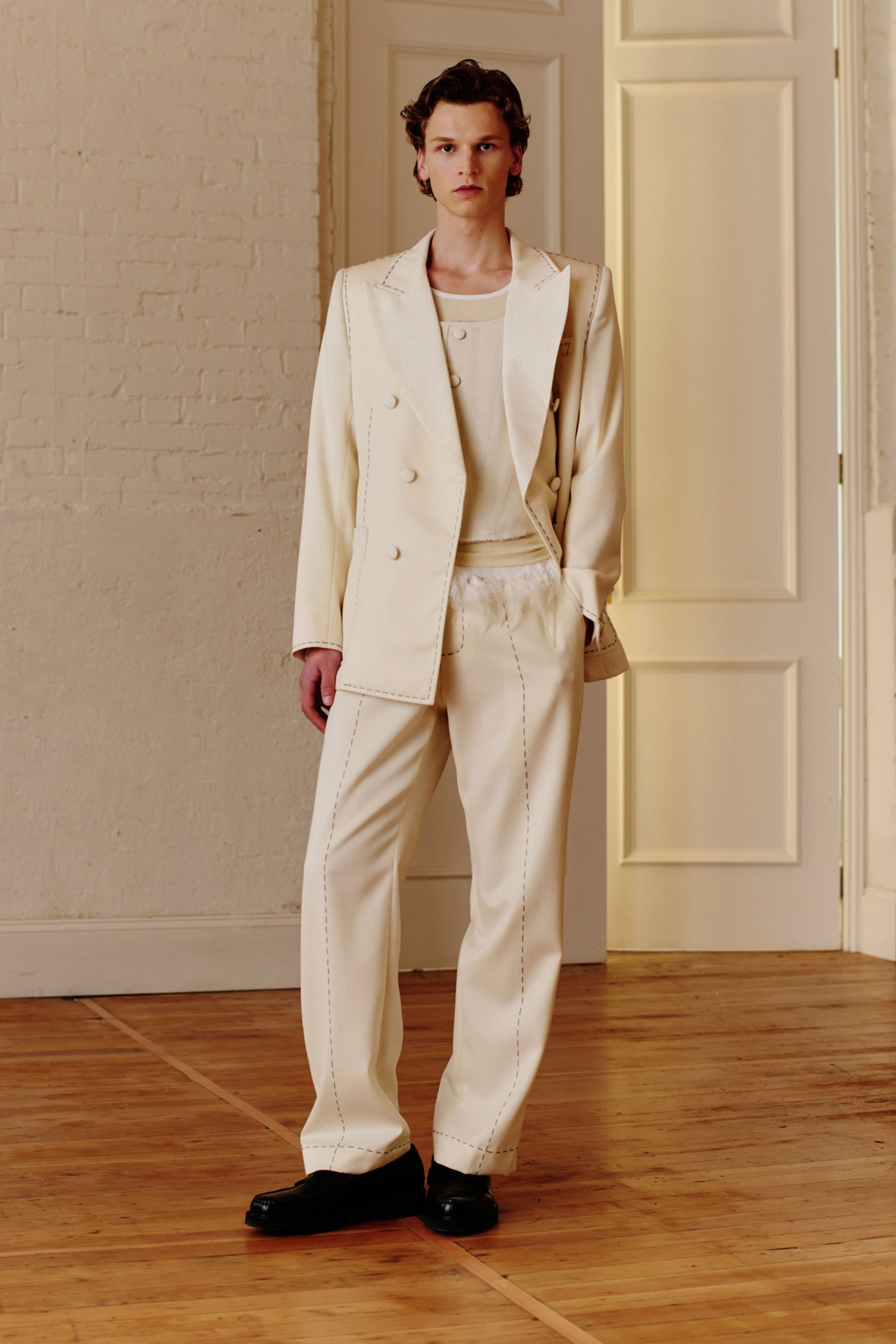white tailored suit with black shoes