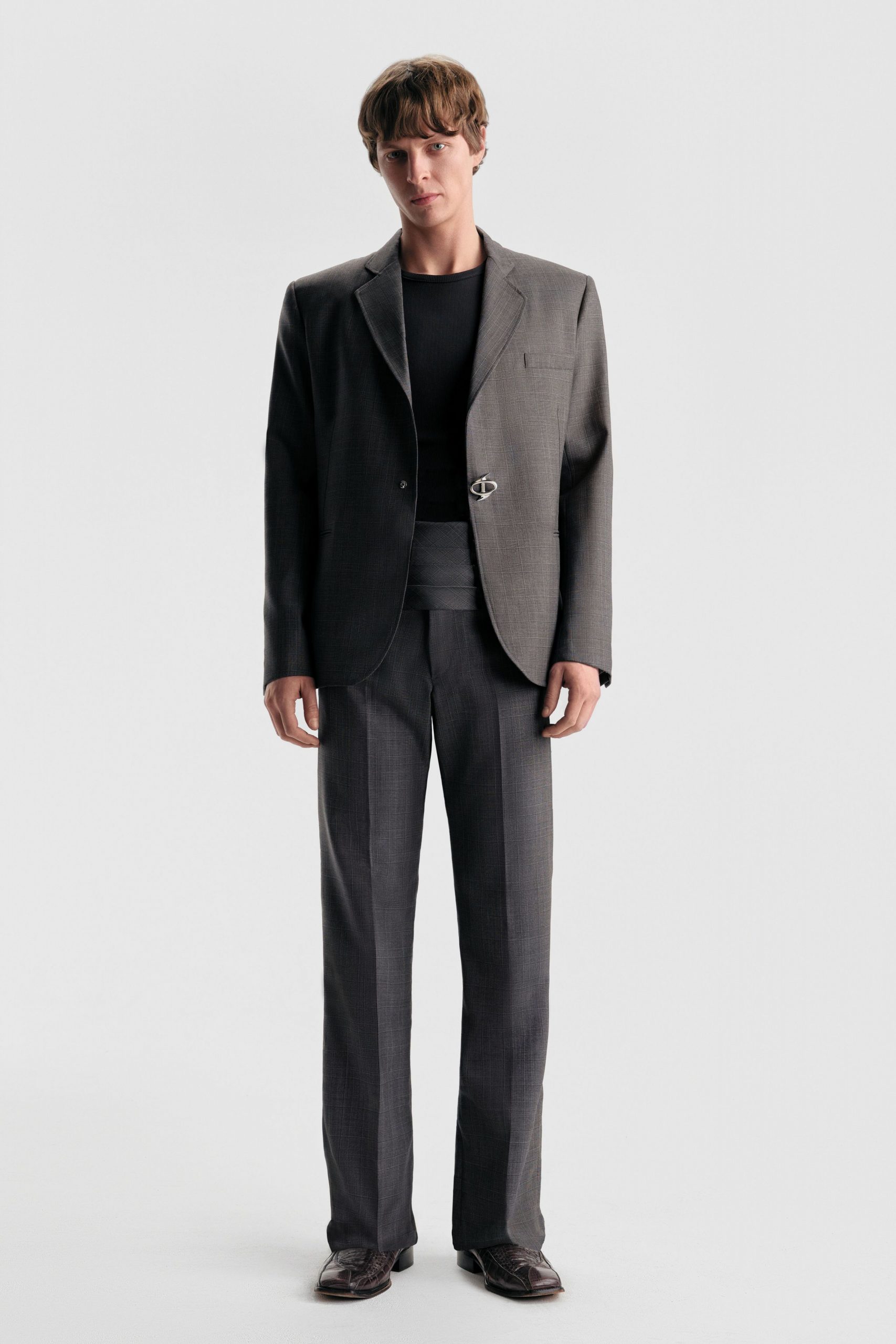 gray tailored blazer with black shirt