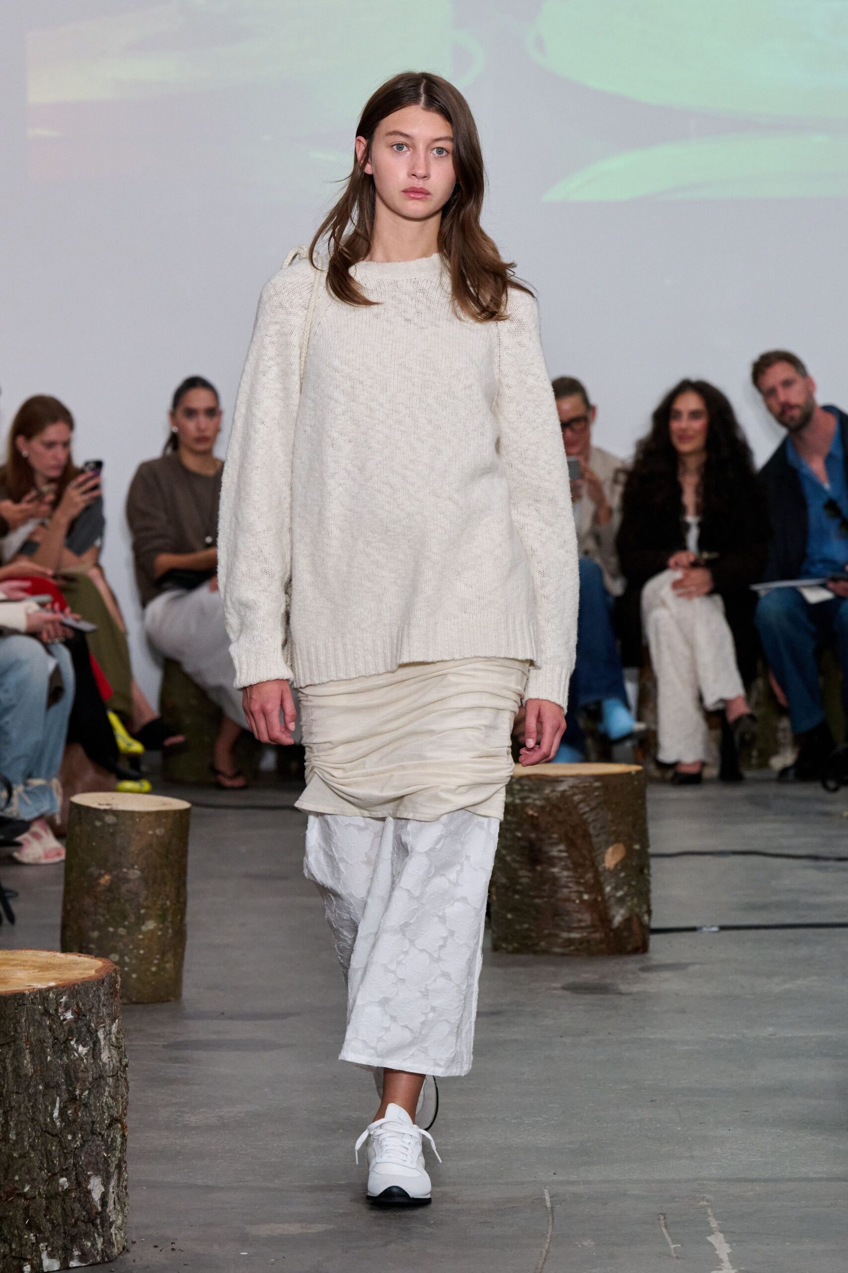white wool relaxed sweater and beige layered skirt