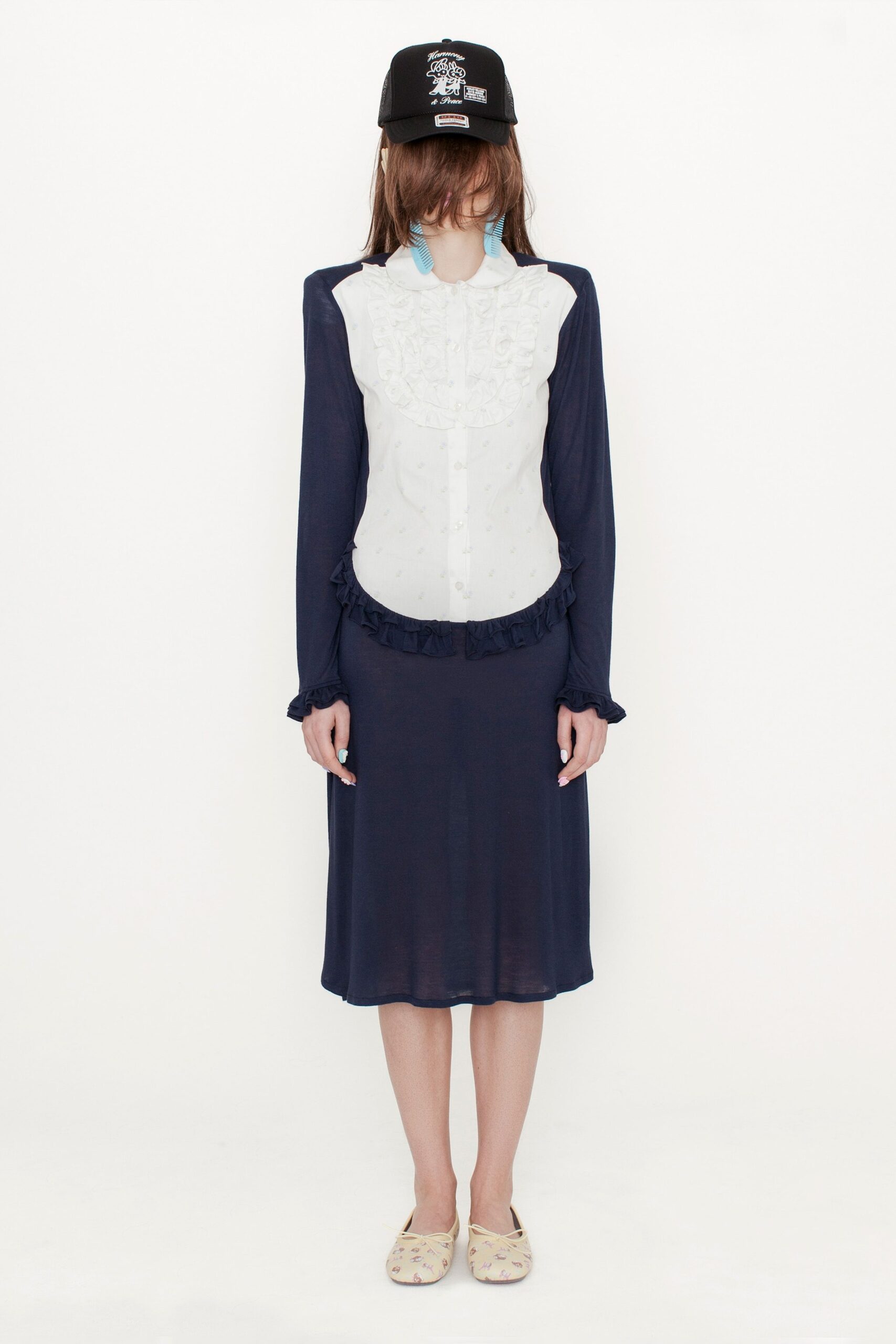 white ruffled blouse with blue skirt