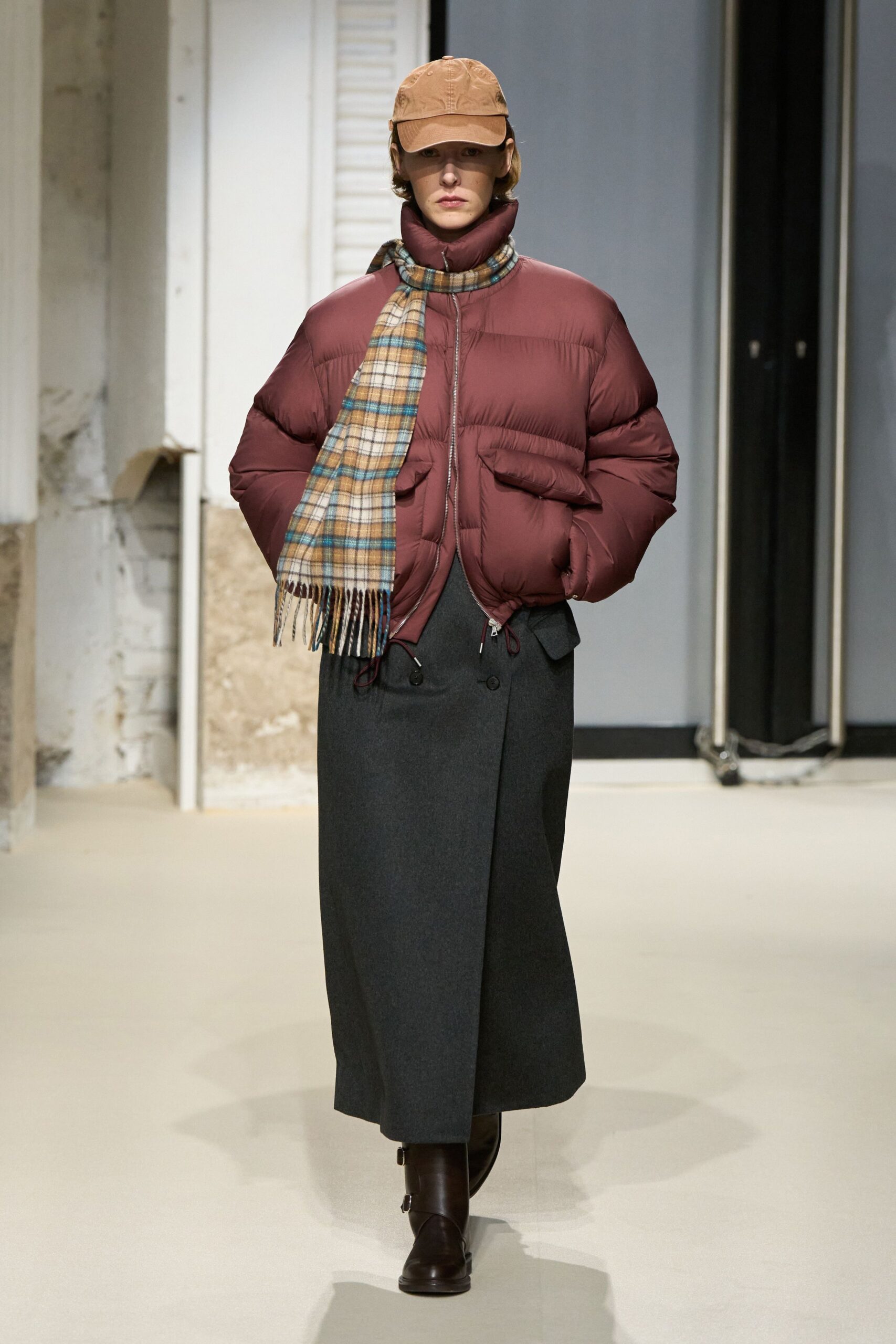 brown puffer jacket with gray skirt