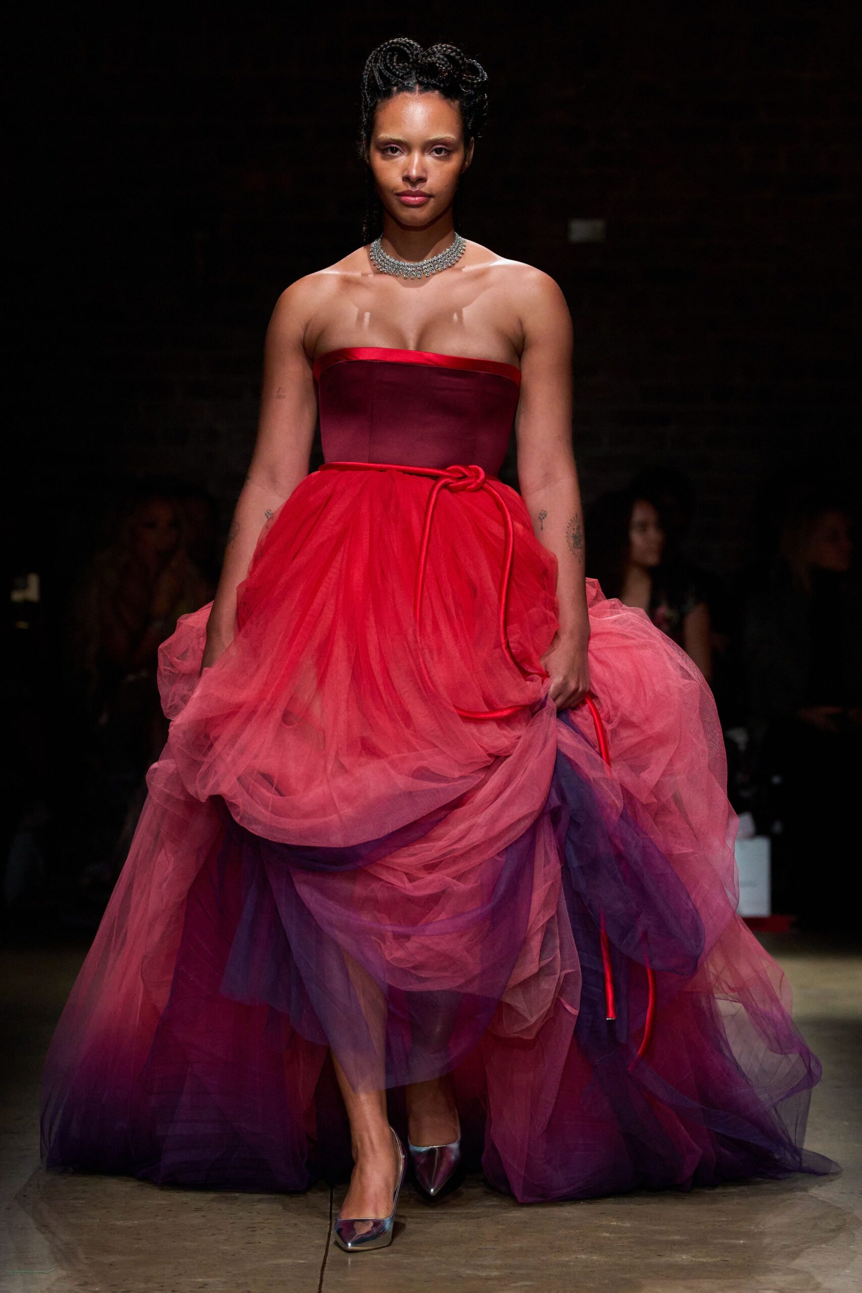 red tulle strapless fitted layered draped flowing gown
