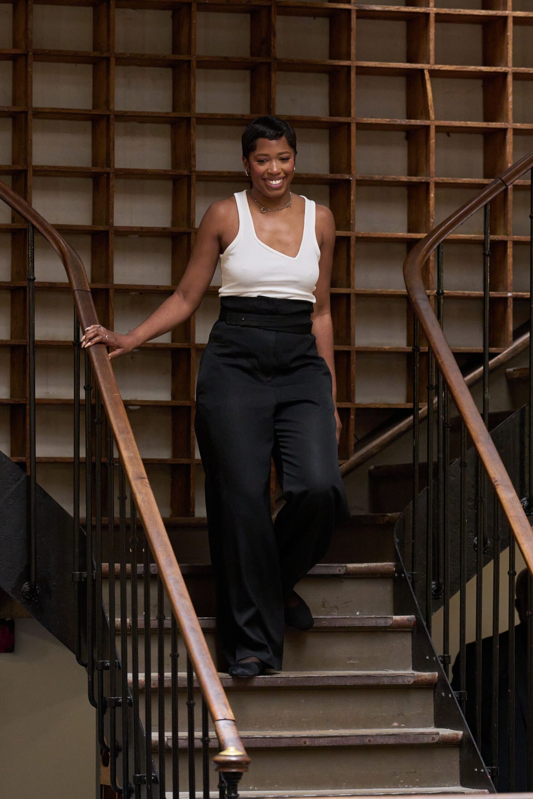 white fitted top with black tailored pants