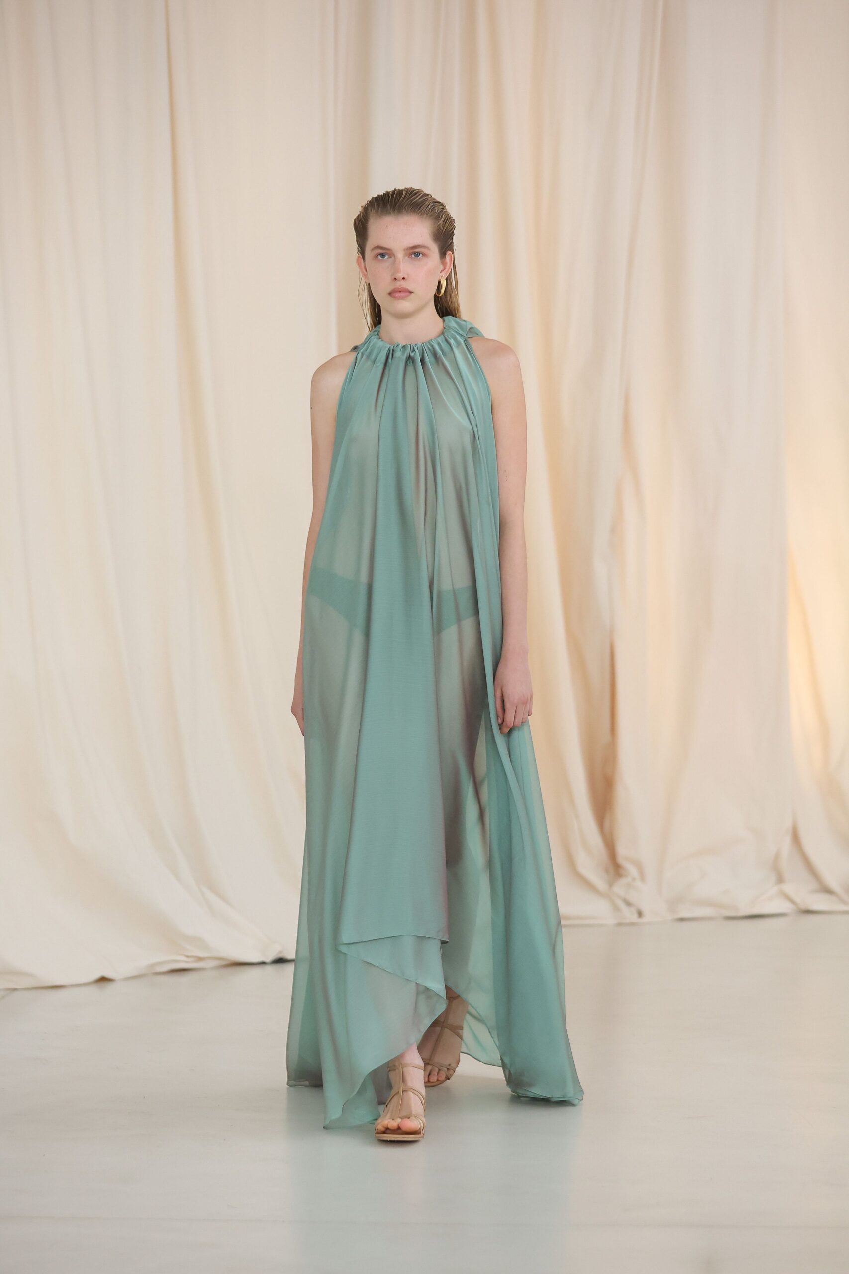 green chiffon sleeveless high-neck relaxed draped layered gown