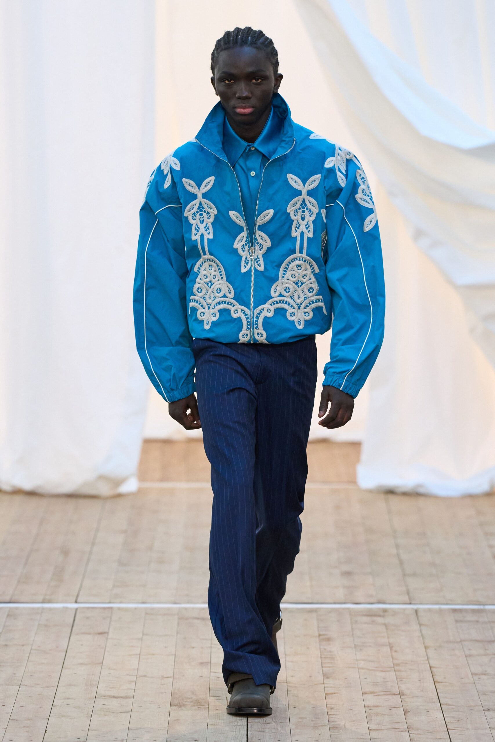blue embroidered jacket with striped pants