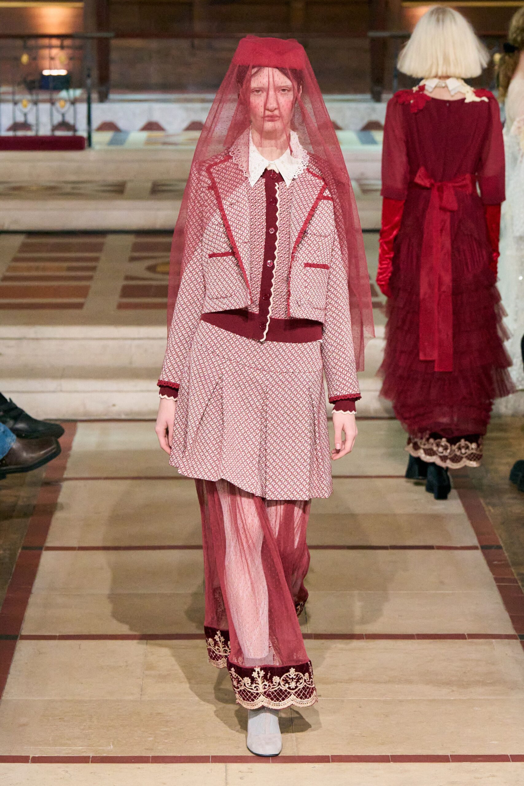 red blazer and skirt with veil