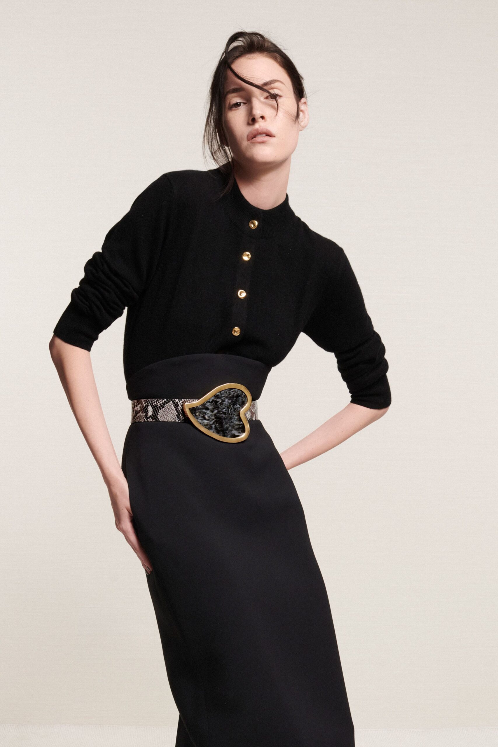 black fitted top and midi skirt