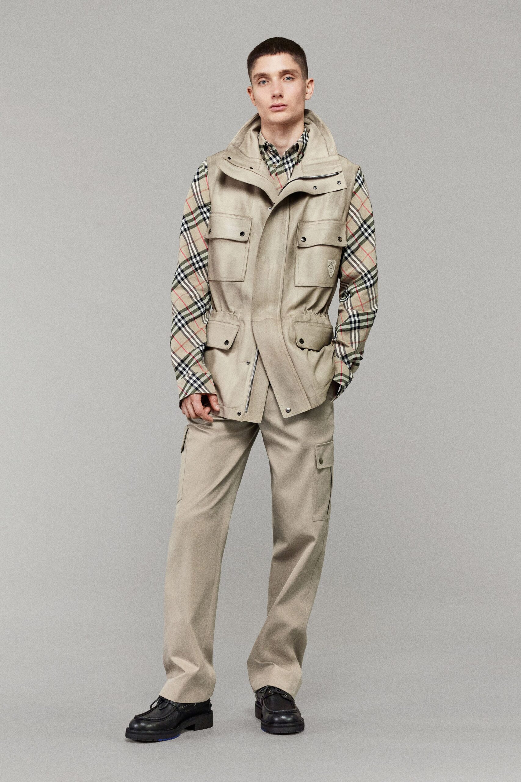 beige cargo vest with checked shirt