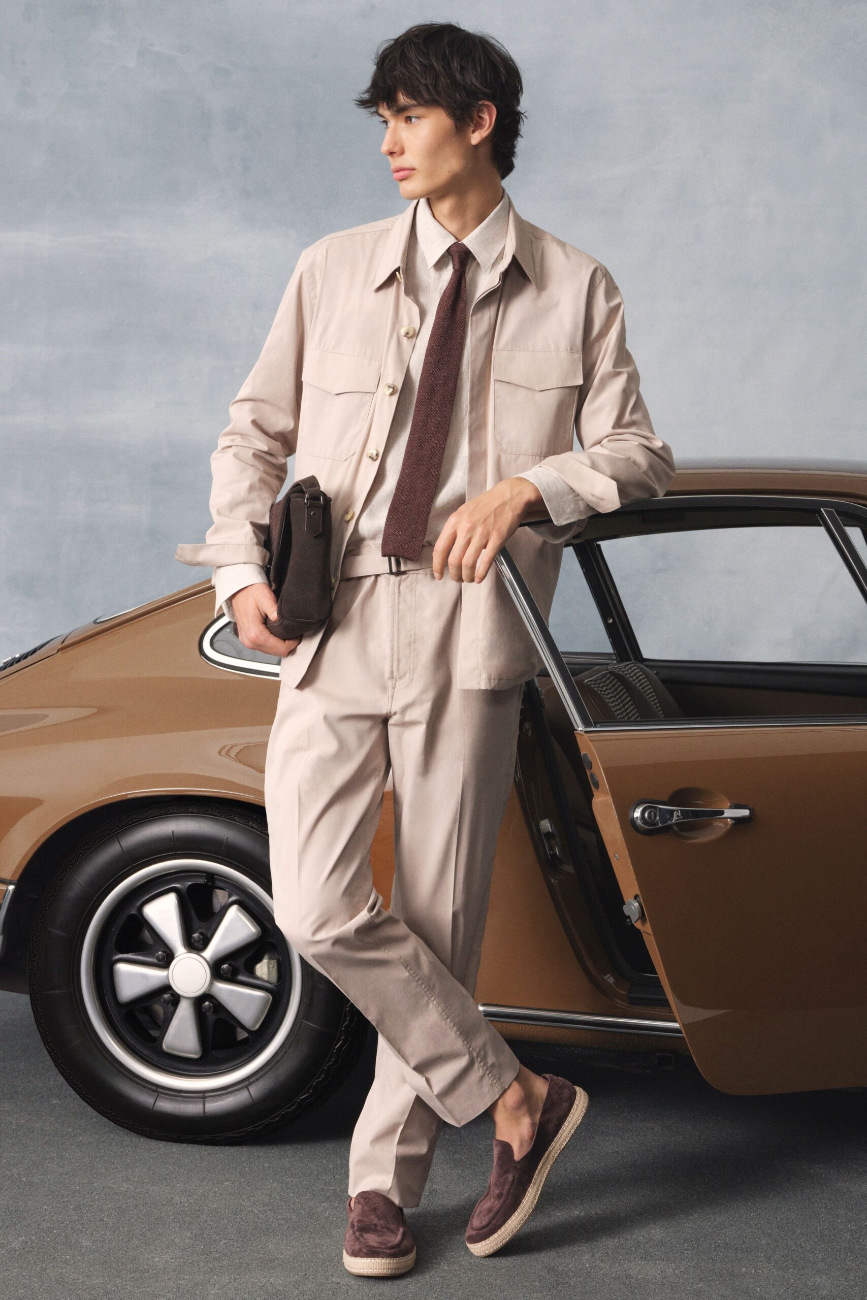 beige tailored suit with brown shoes