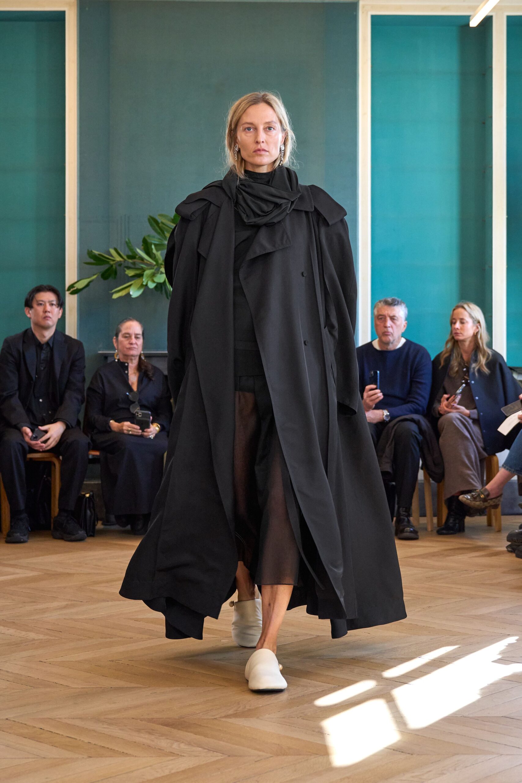 black coat with white shoes