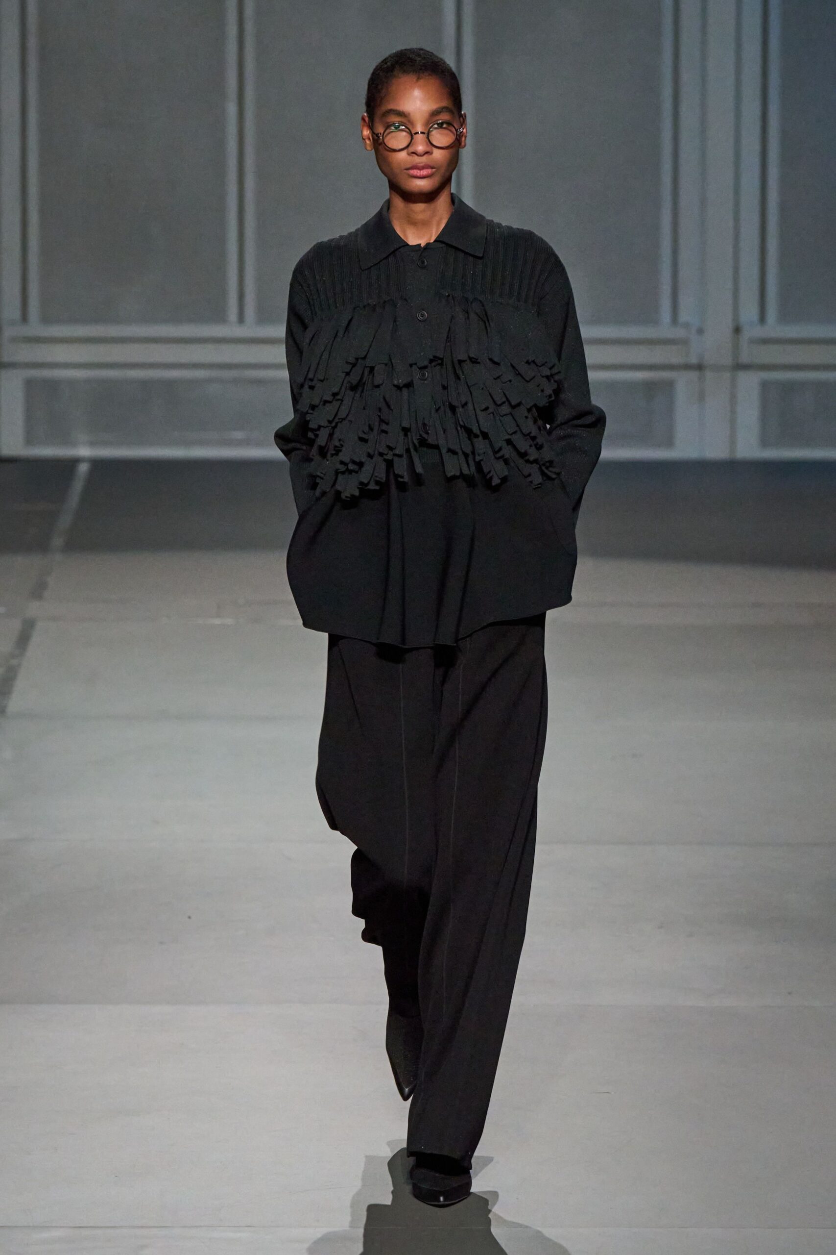 black oversized top with fringes