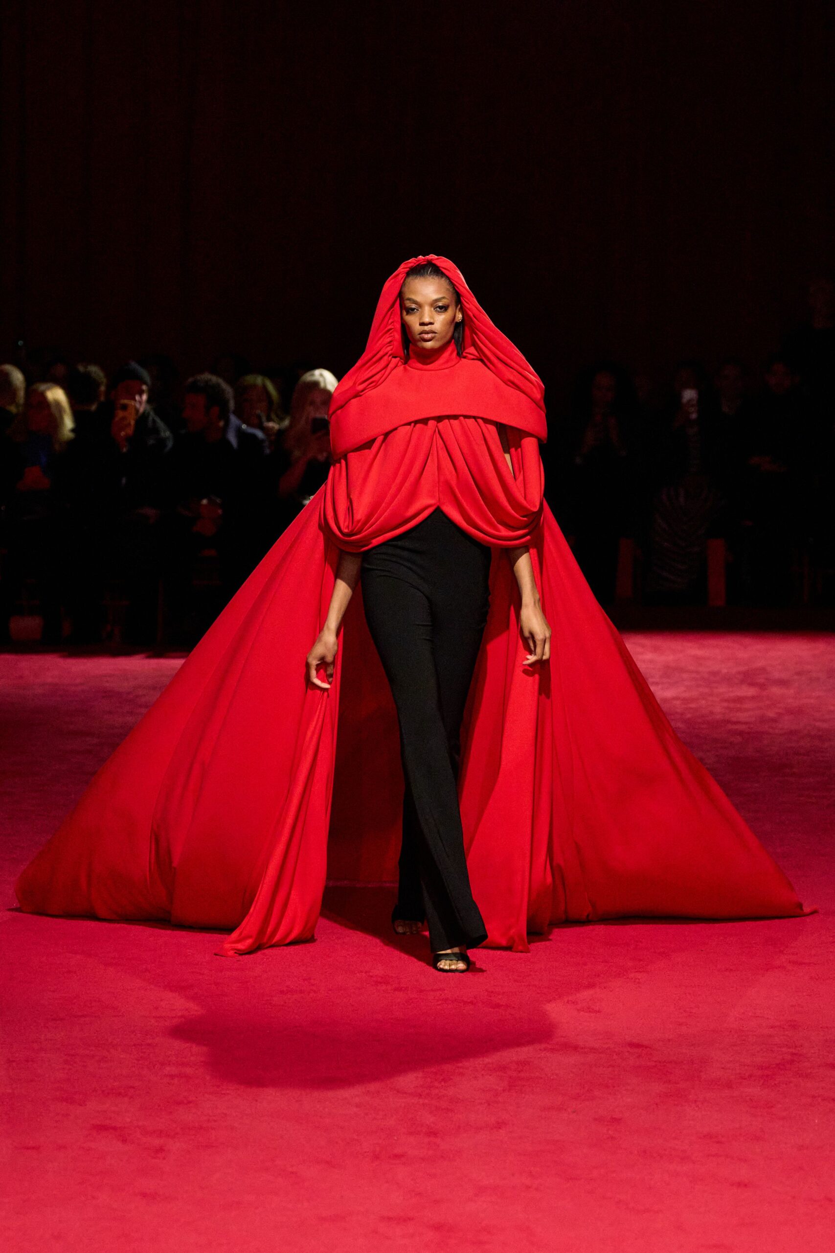 red silk cape with black pants