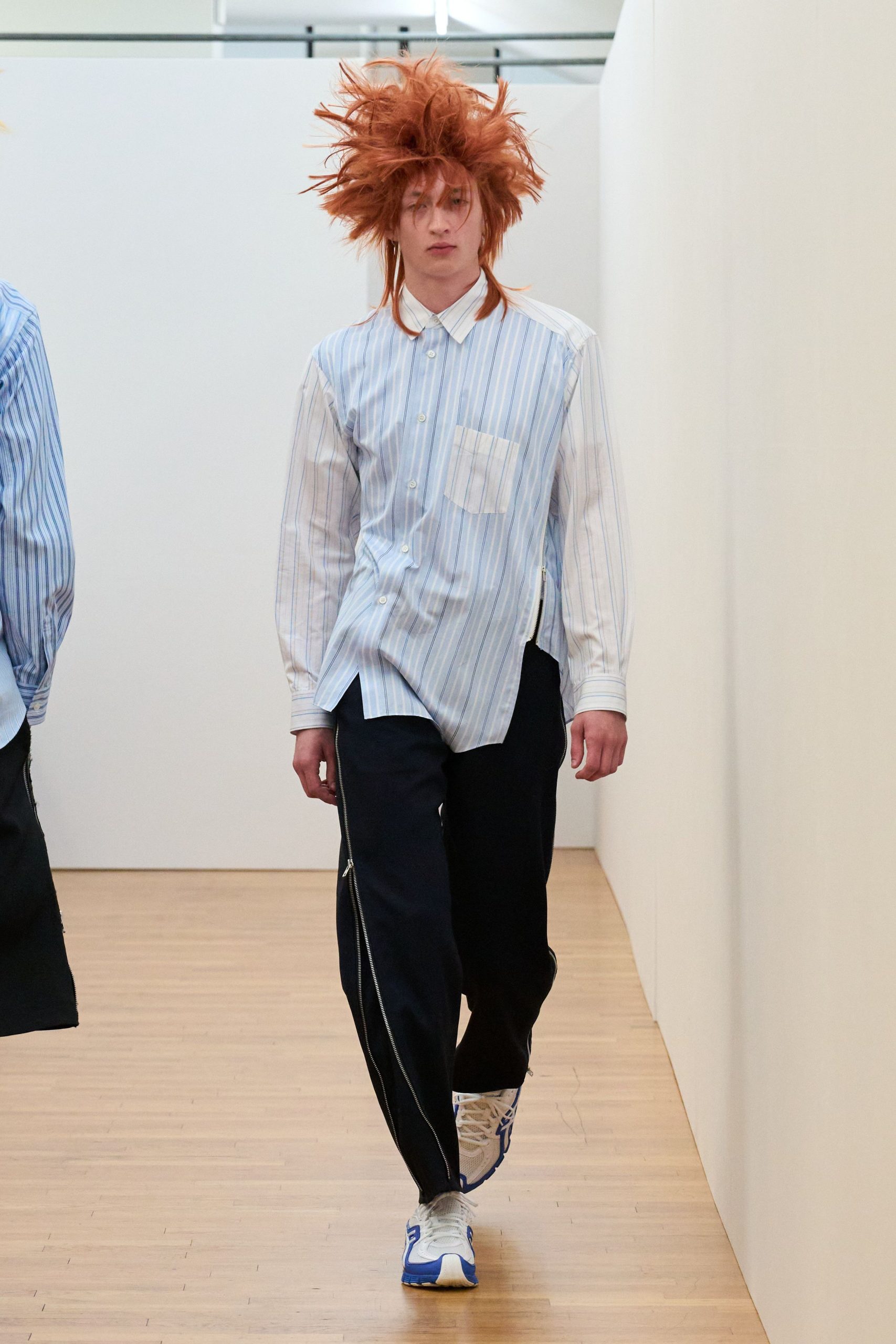 blue and white striped shirt with black pants