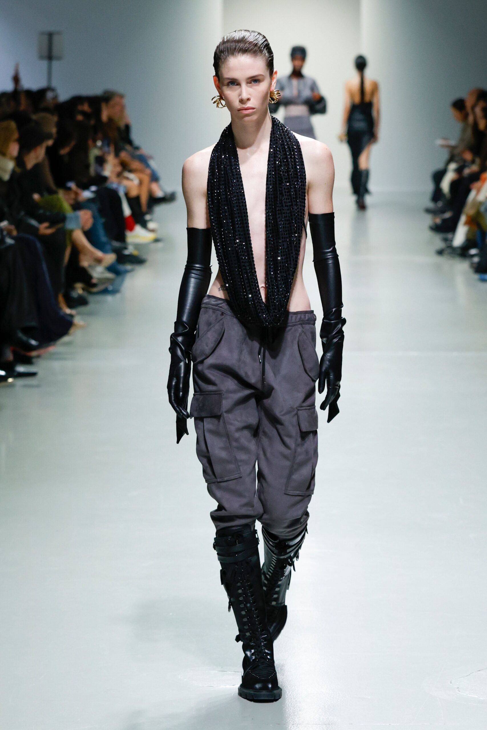black silk sleeveless top with cargo pants
