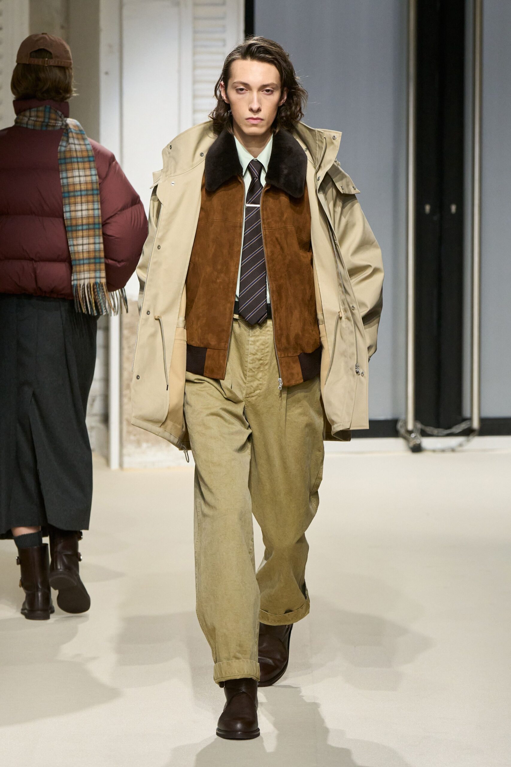 beige coat brown jacket white shirt green pants brown boots