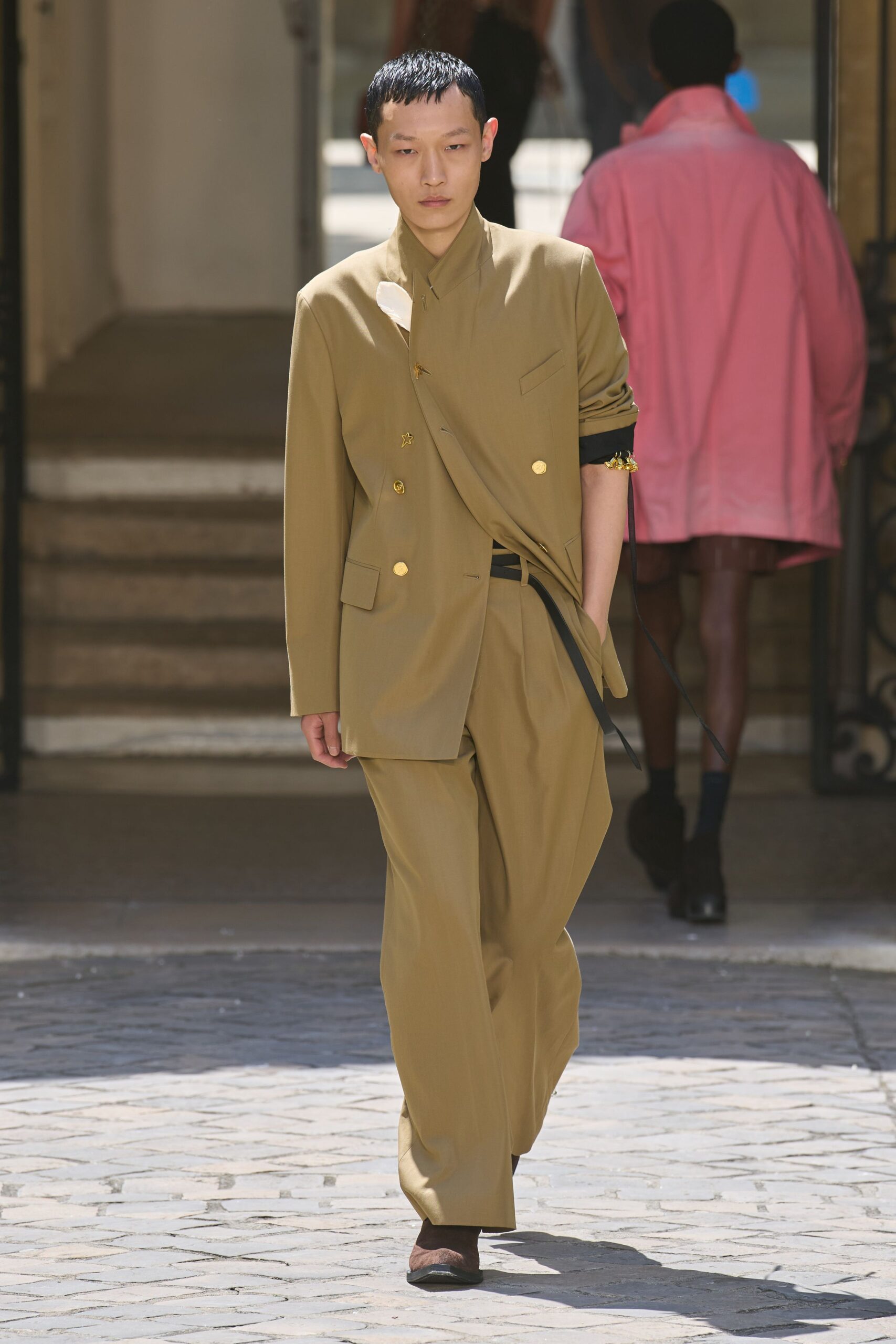 beige tailored suit with brown shoes