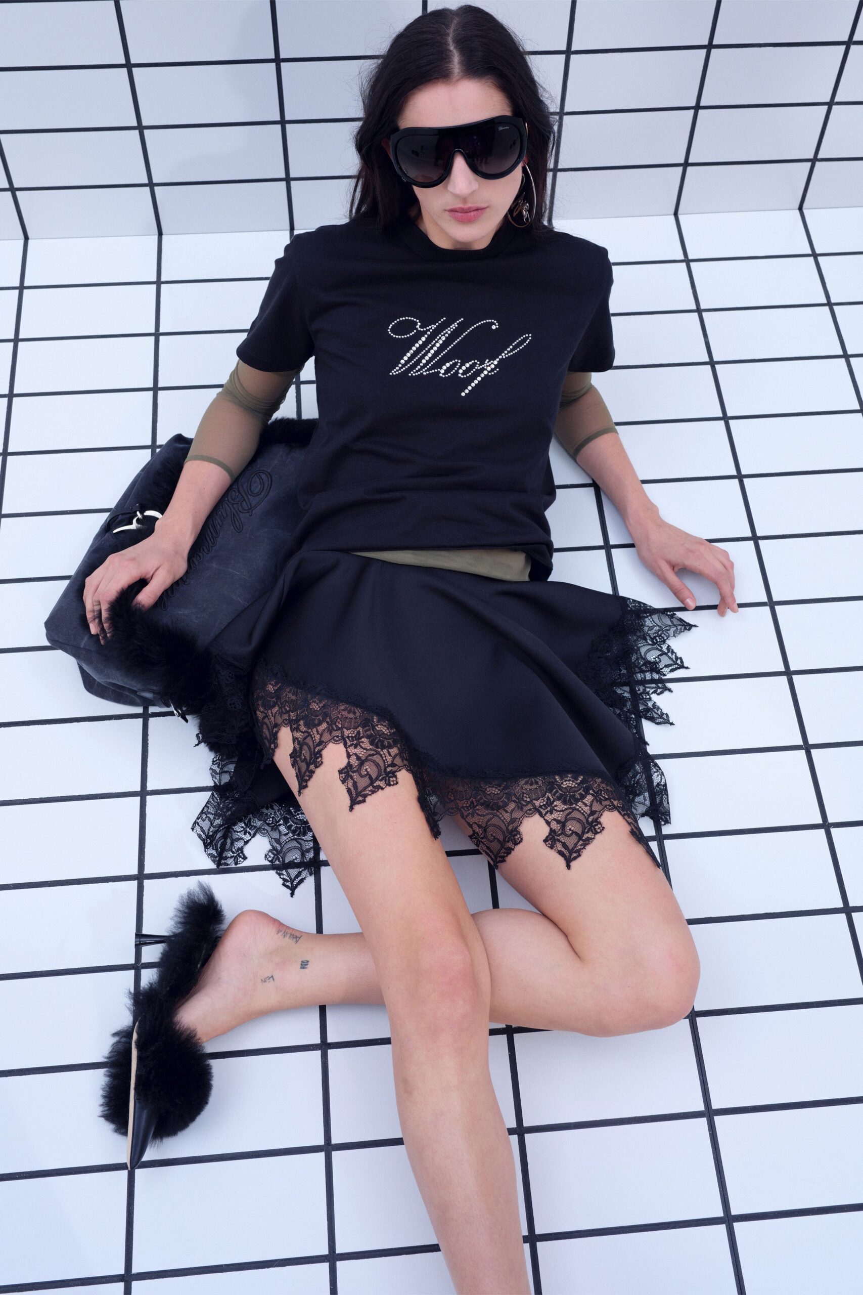 black fitted top and mini skirt