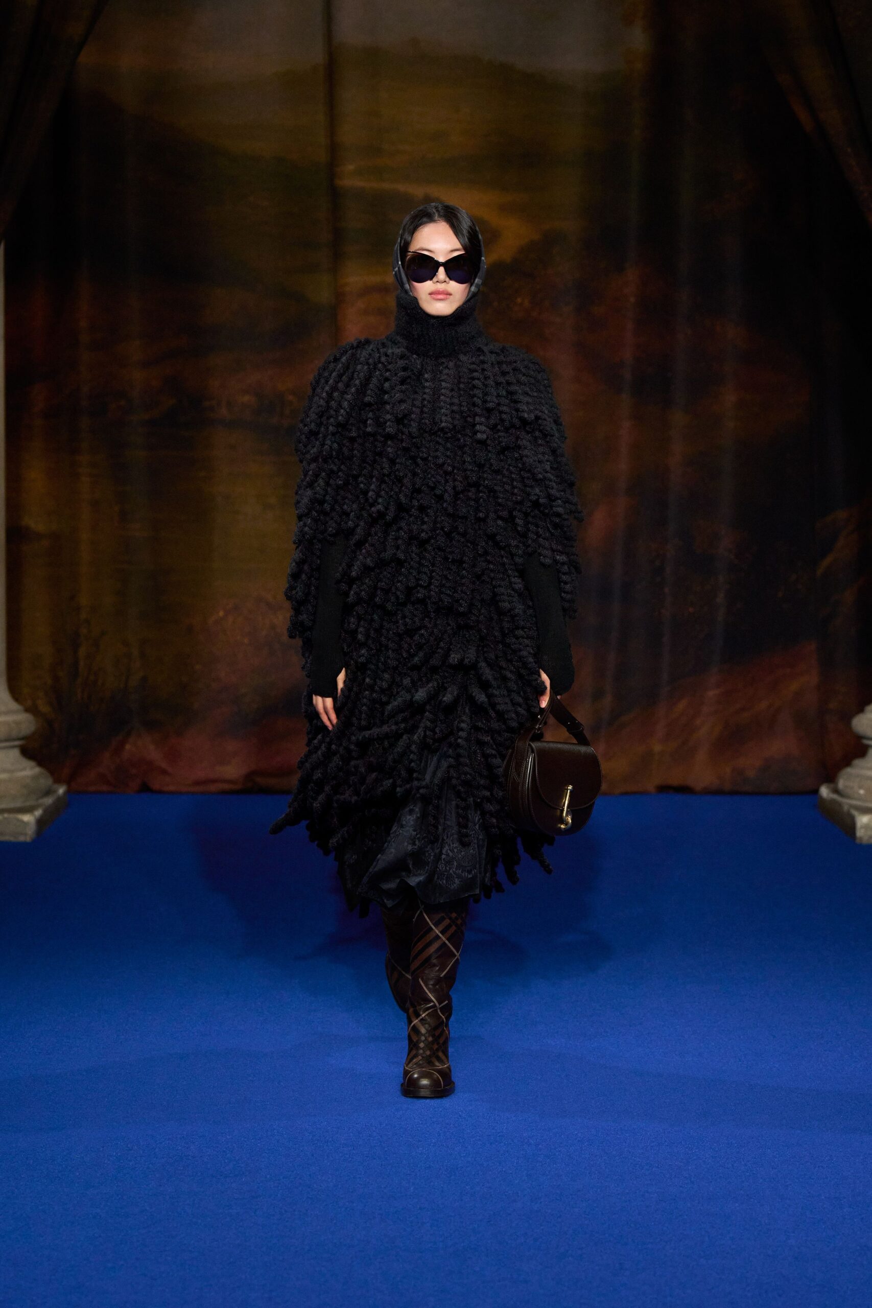 black oversized cape with leather pants