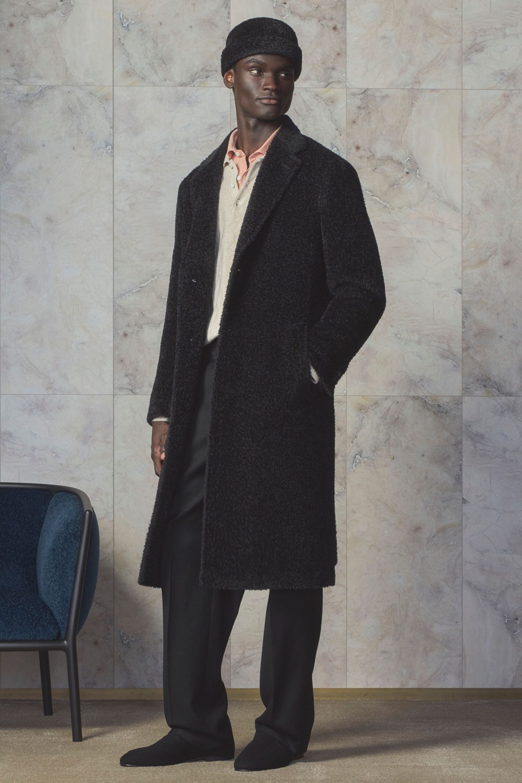 black wool coat with ivory sweater