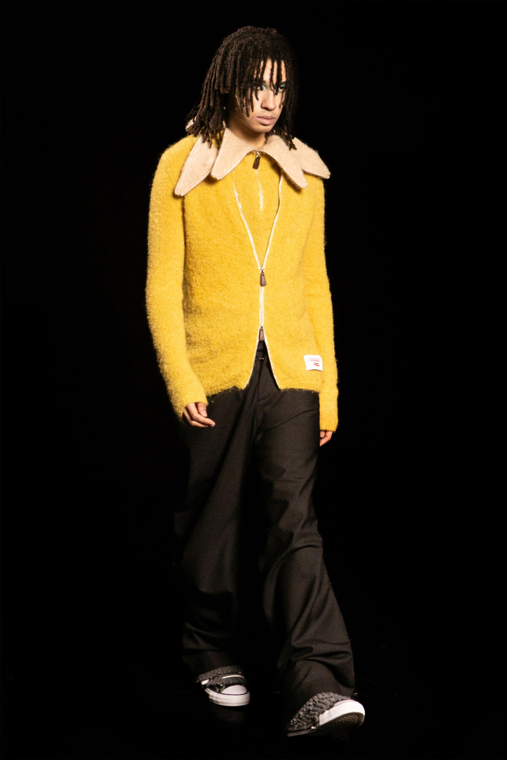yellow wool cardigan with black pants