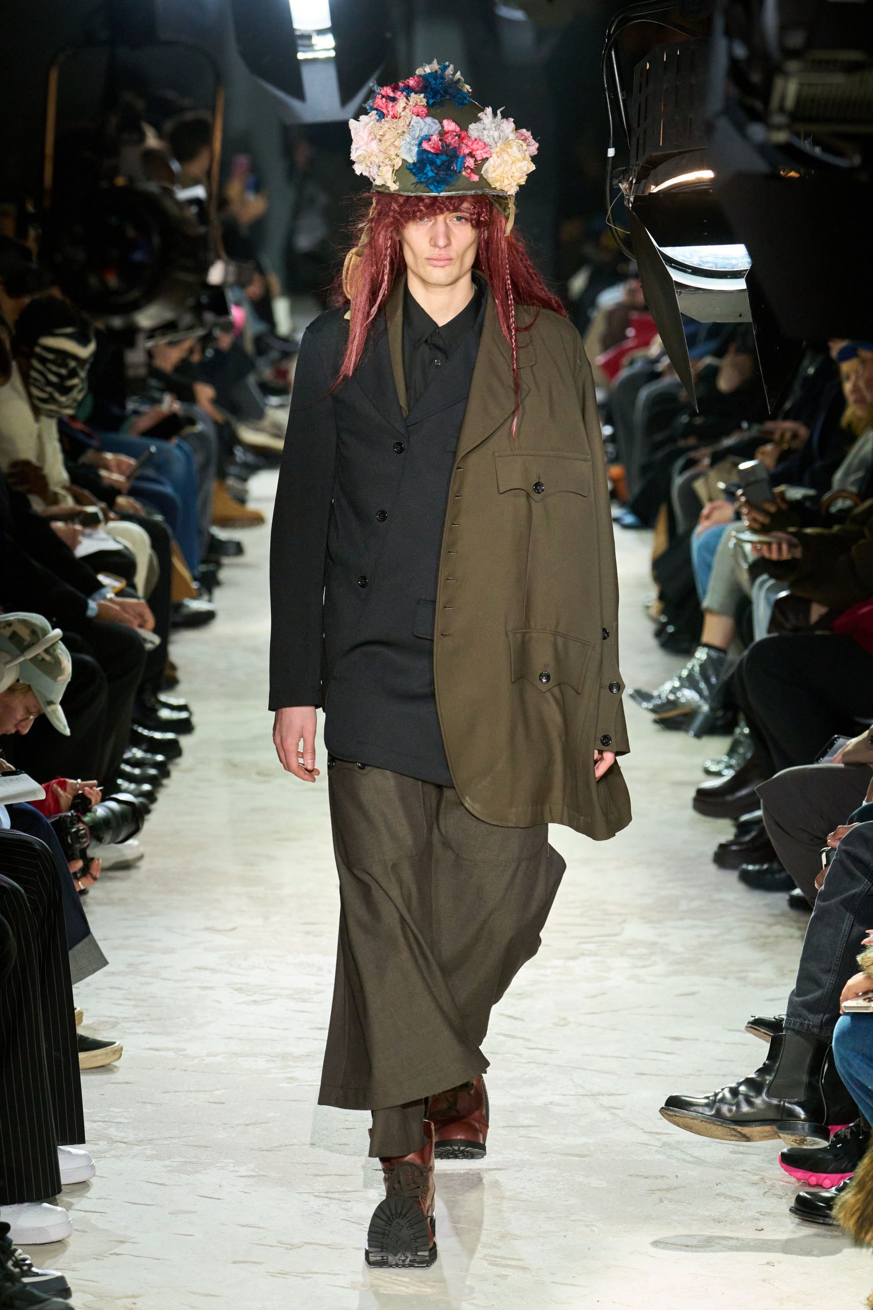 green coat black shirt brown pants