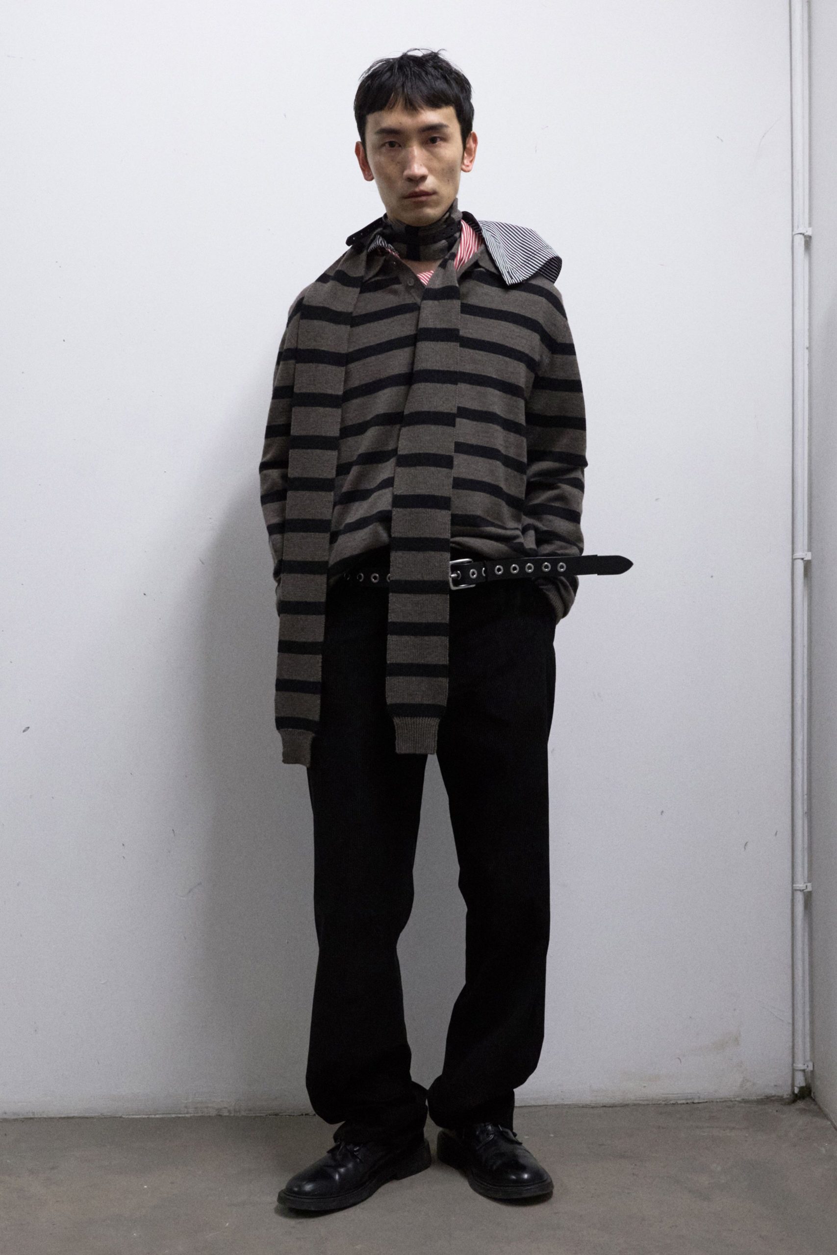 brown striped sweater with black pants