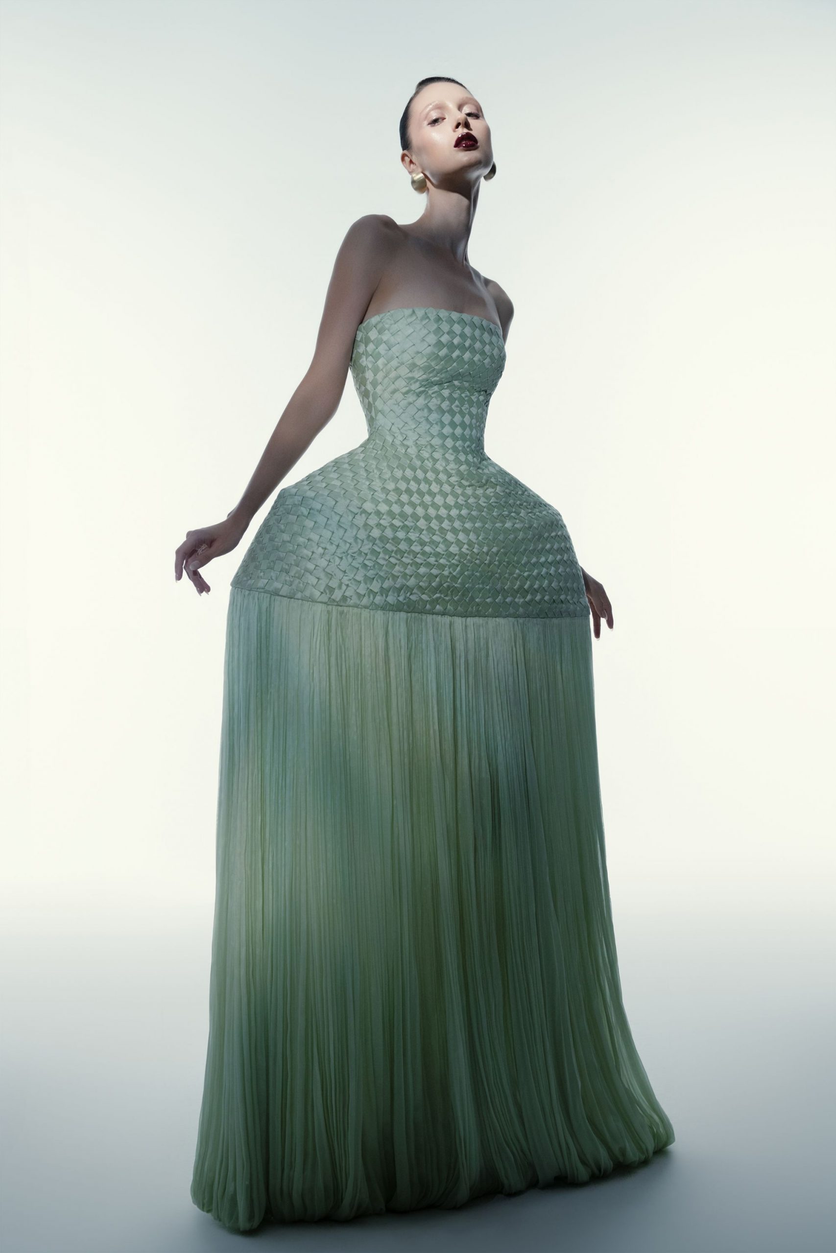 green pleated strapless gown