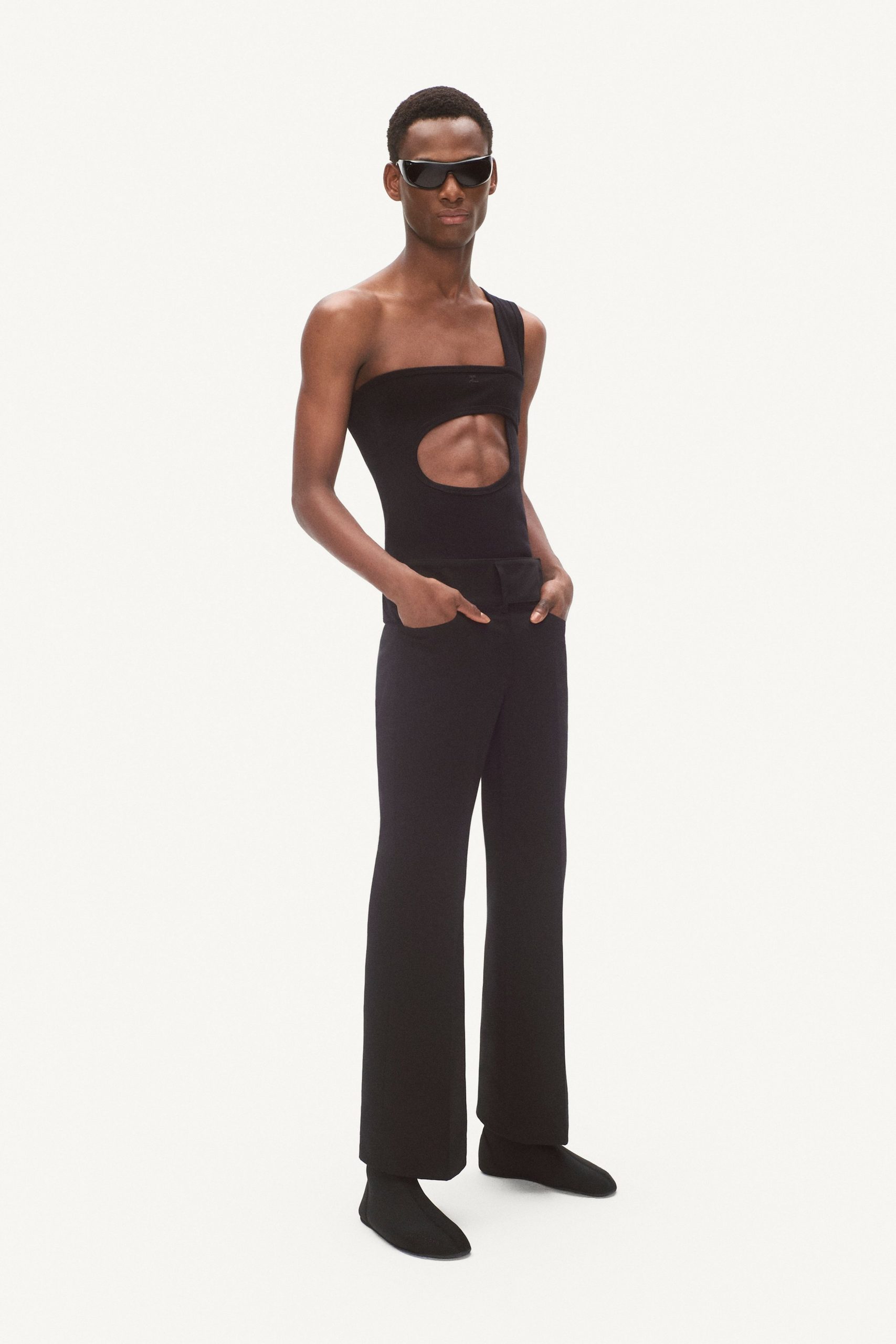 black fitted catsuit and flared pants