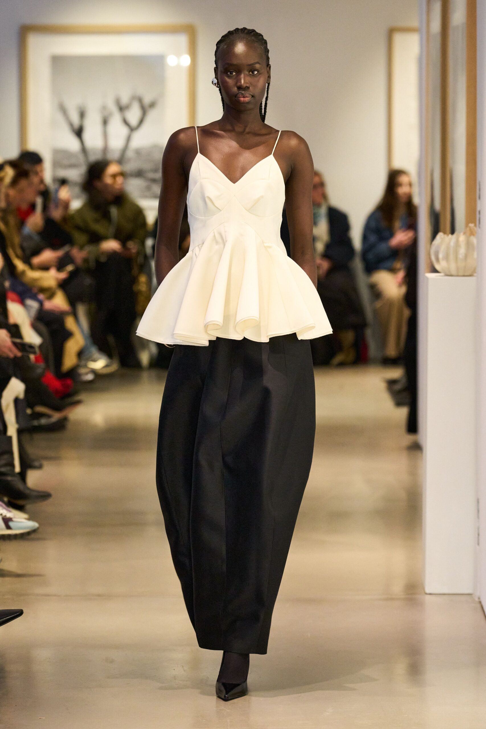 white pleated top black pants