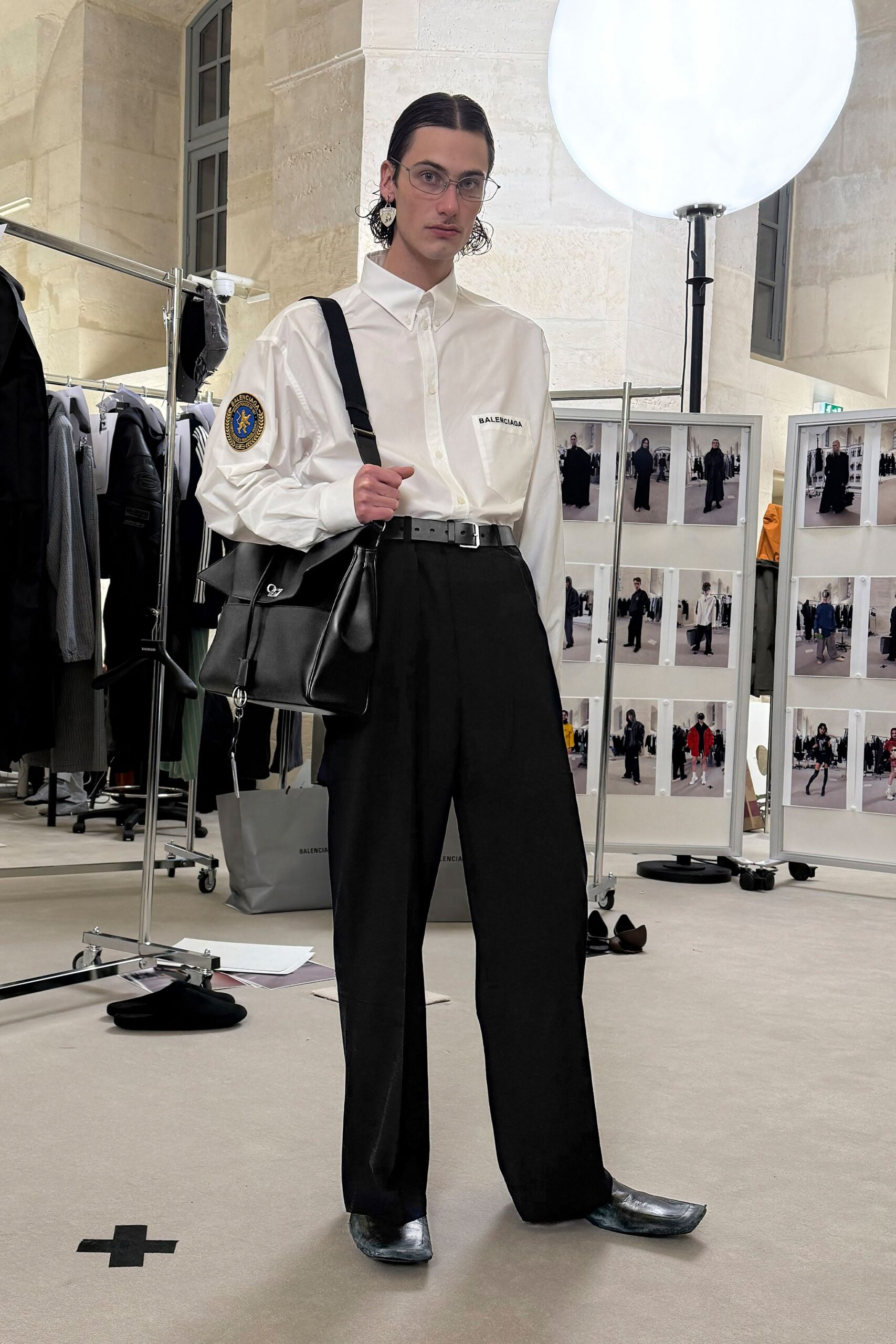 white relaxed shirt with black pants
