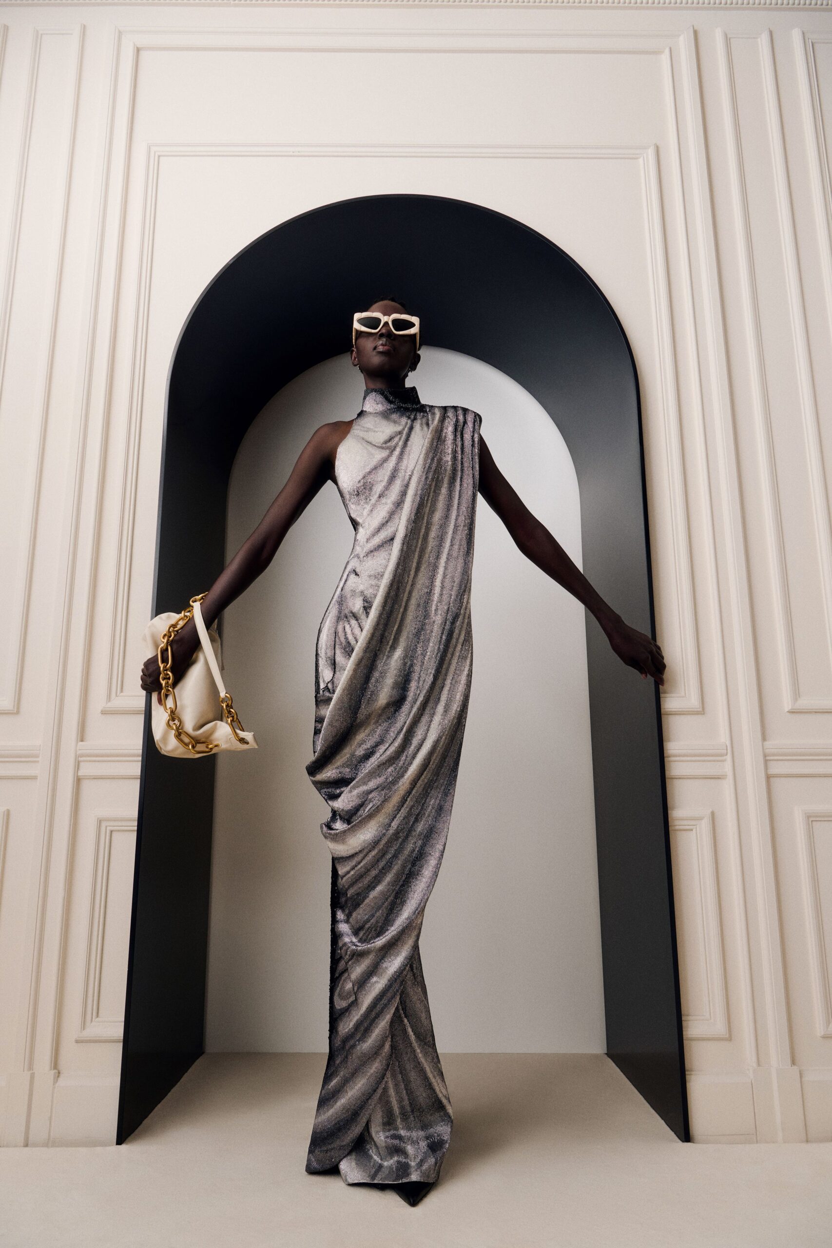 gray silk sleeveless high-neck fitted draped flowing gown