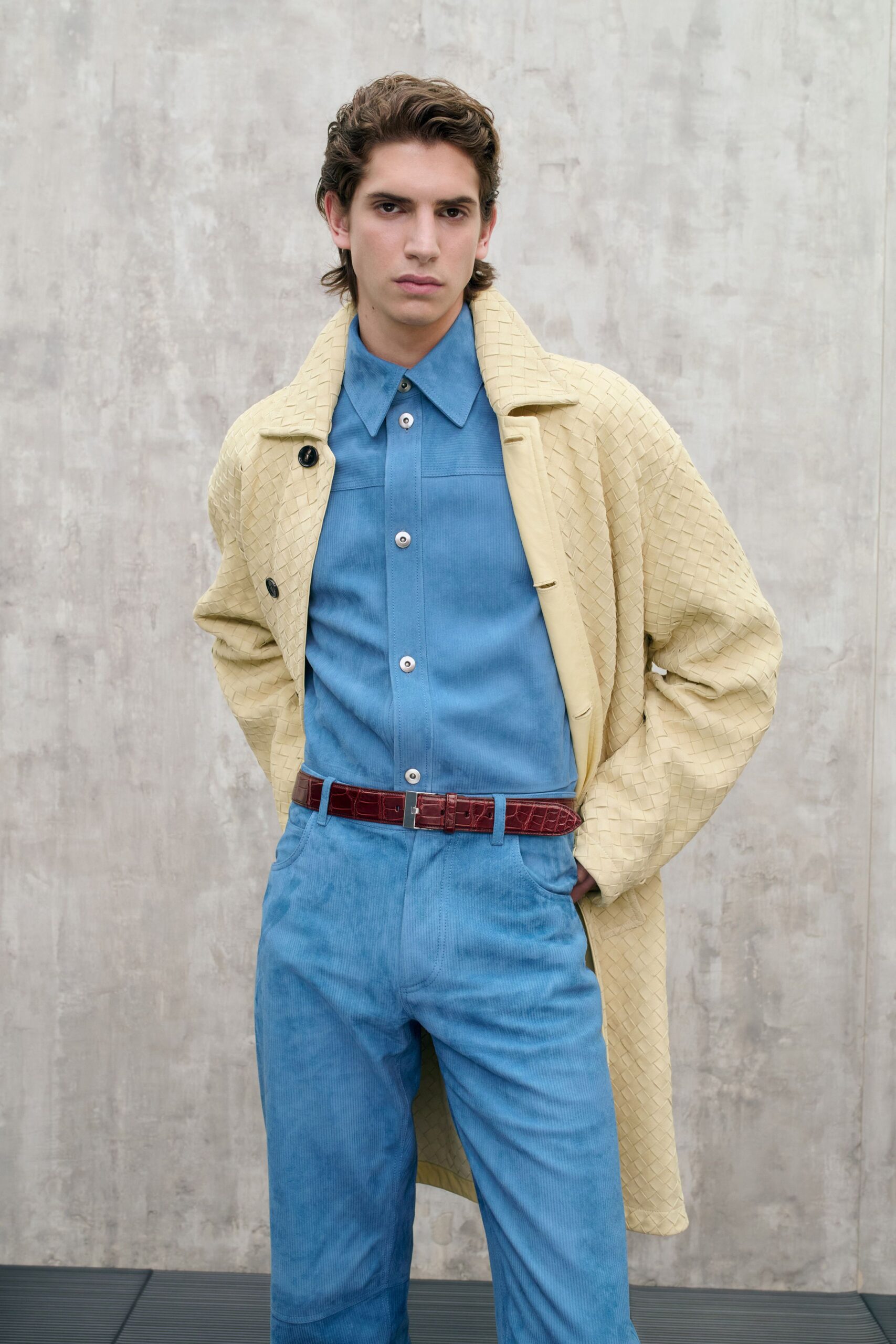 beige coat blue shirt blue pants