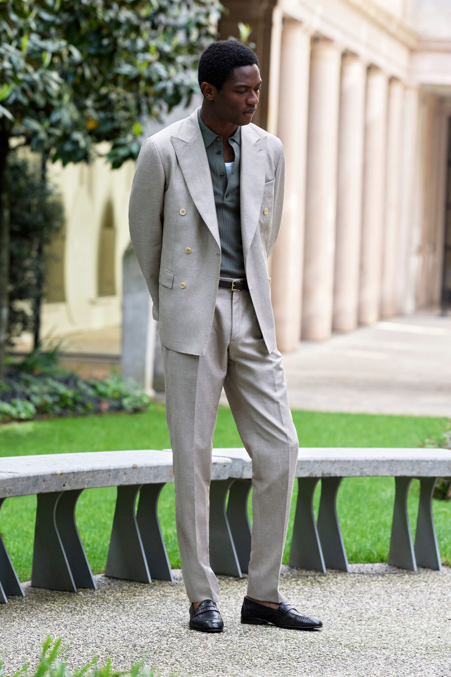 beige tailored suit with gray shirt