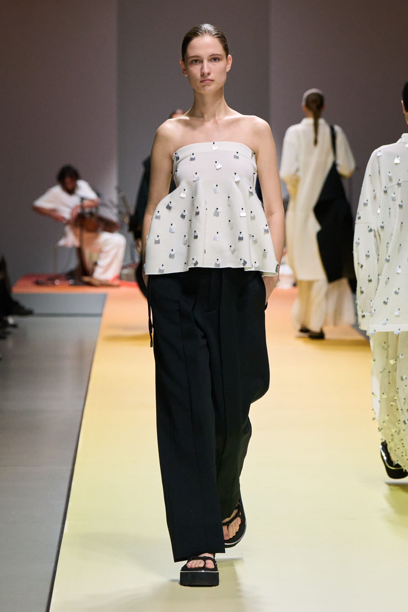 white embroidered top with black pants
