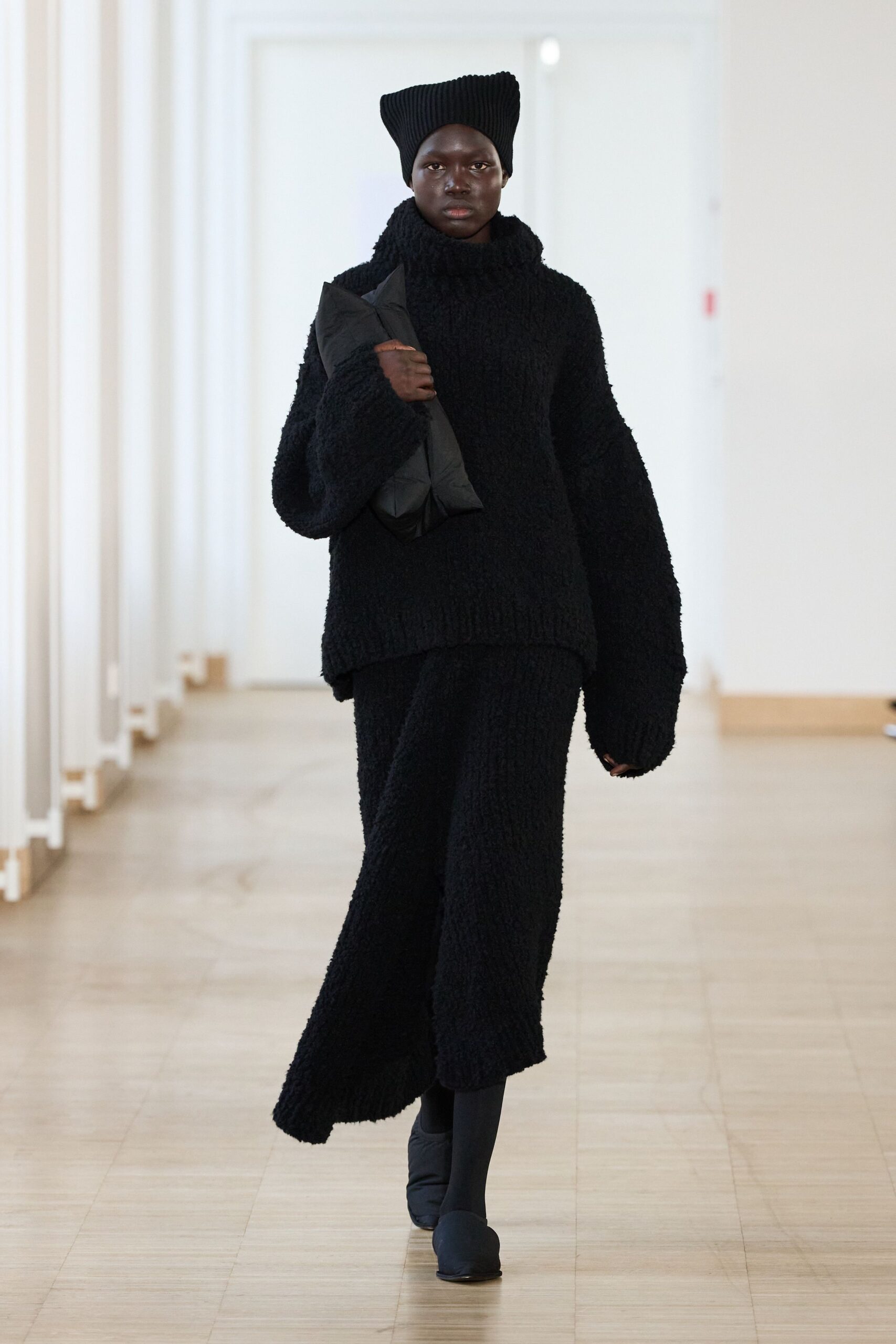 black oversized sweater and midi skirt