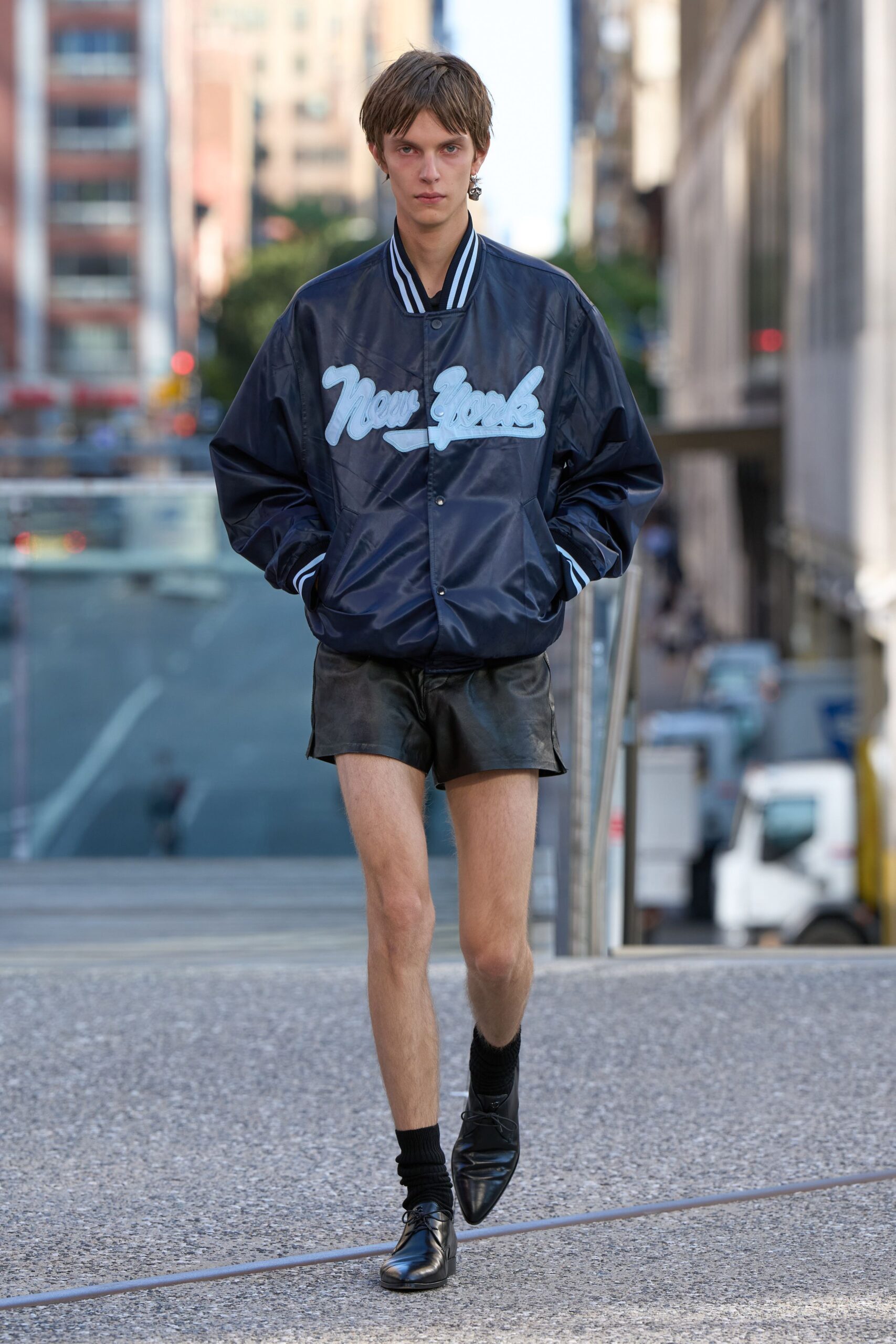 blue embroidered jacket with black shorts