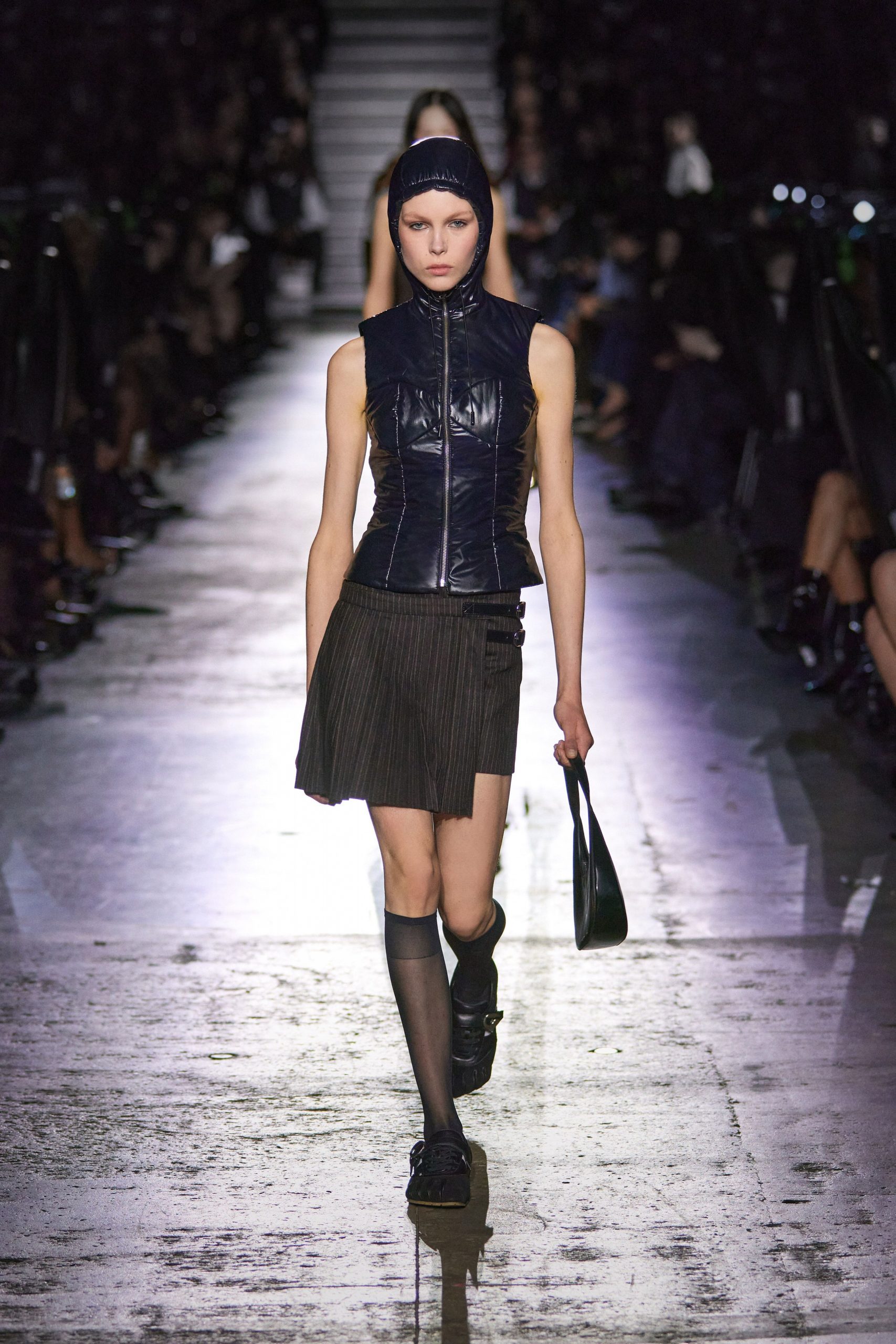 black leather fitted top and pleated skirt