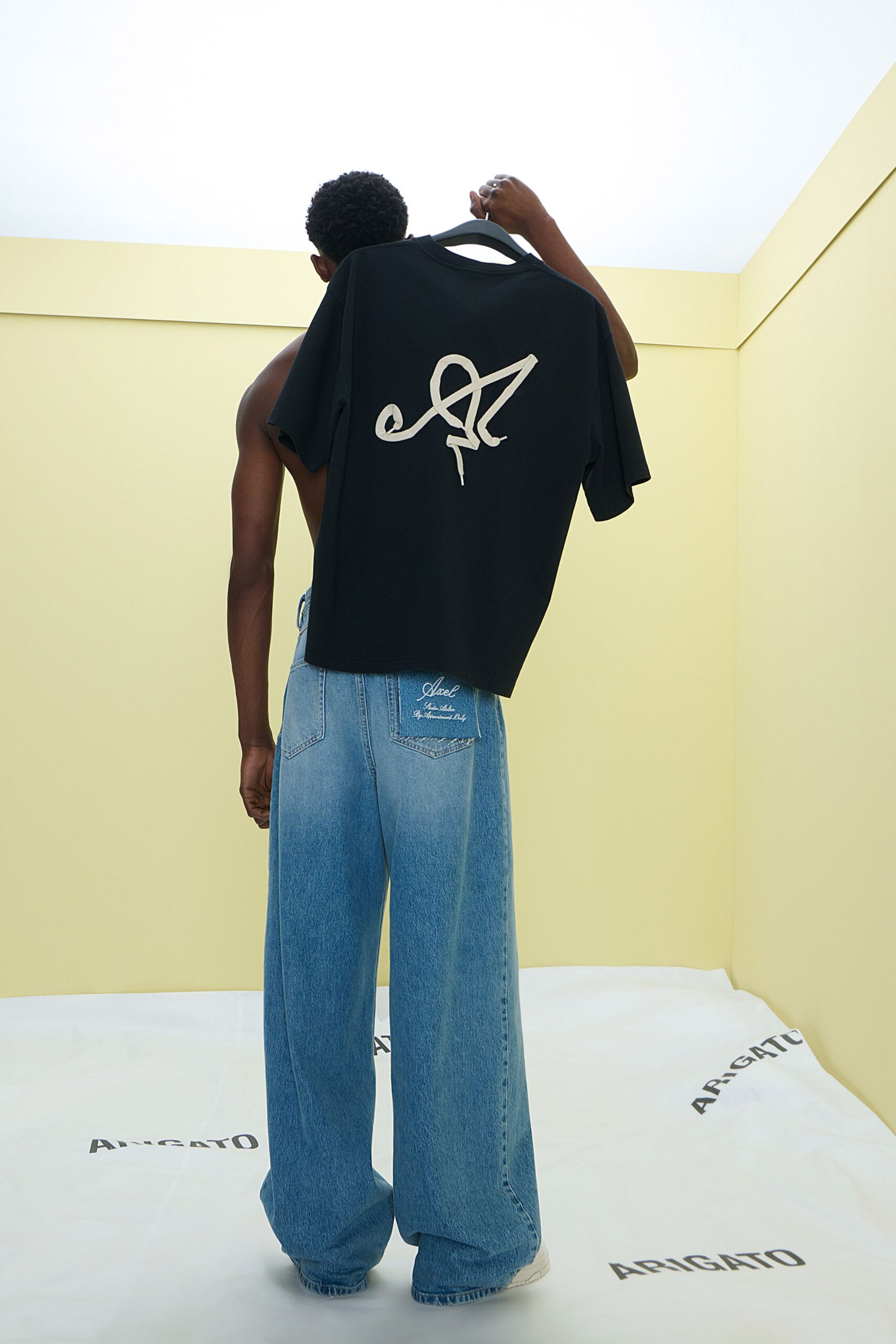 black t-shirt and blue jeans