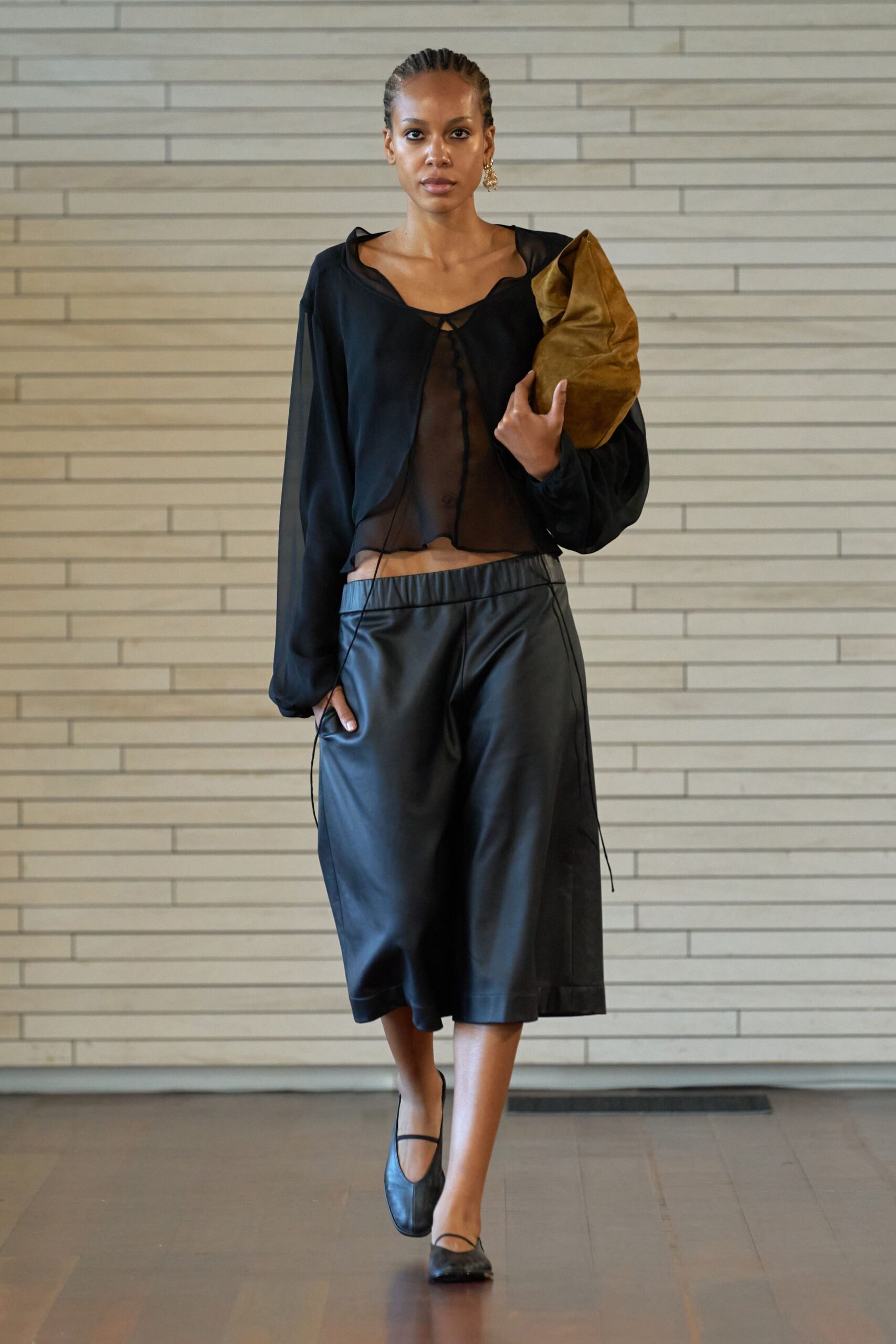 black sheer top with wide-leg pants