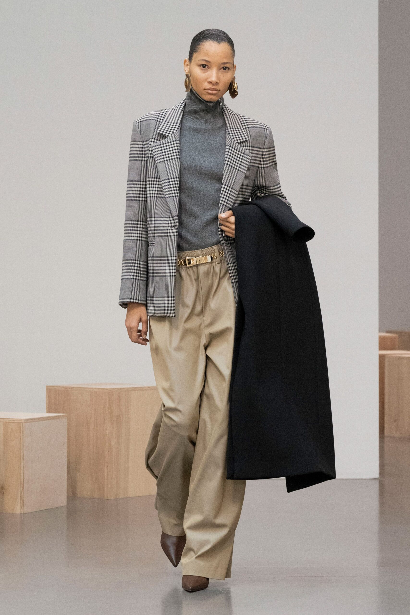 gray checked blazer with beige pants