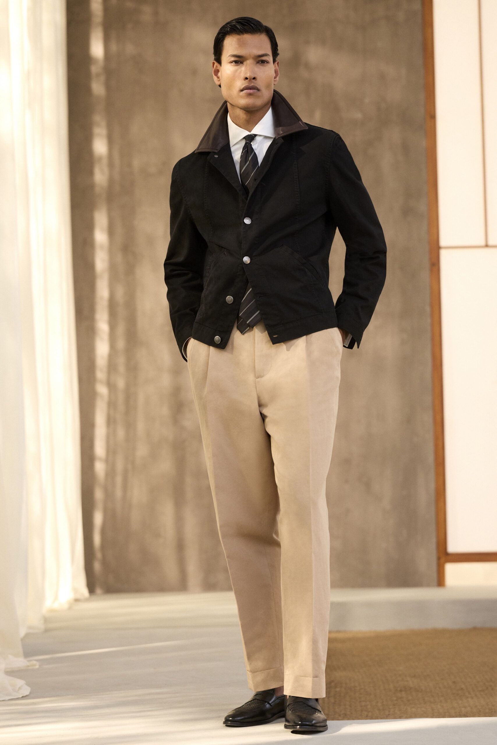 black jacket with beige pants