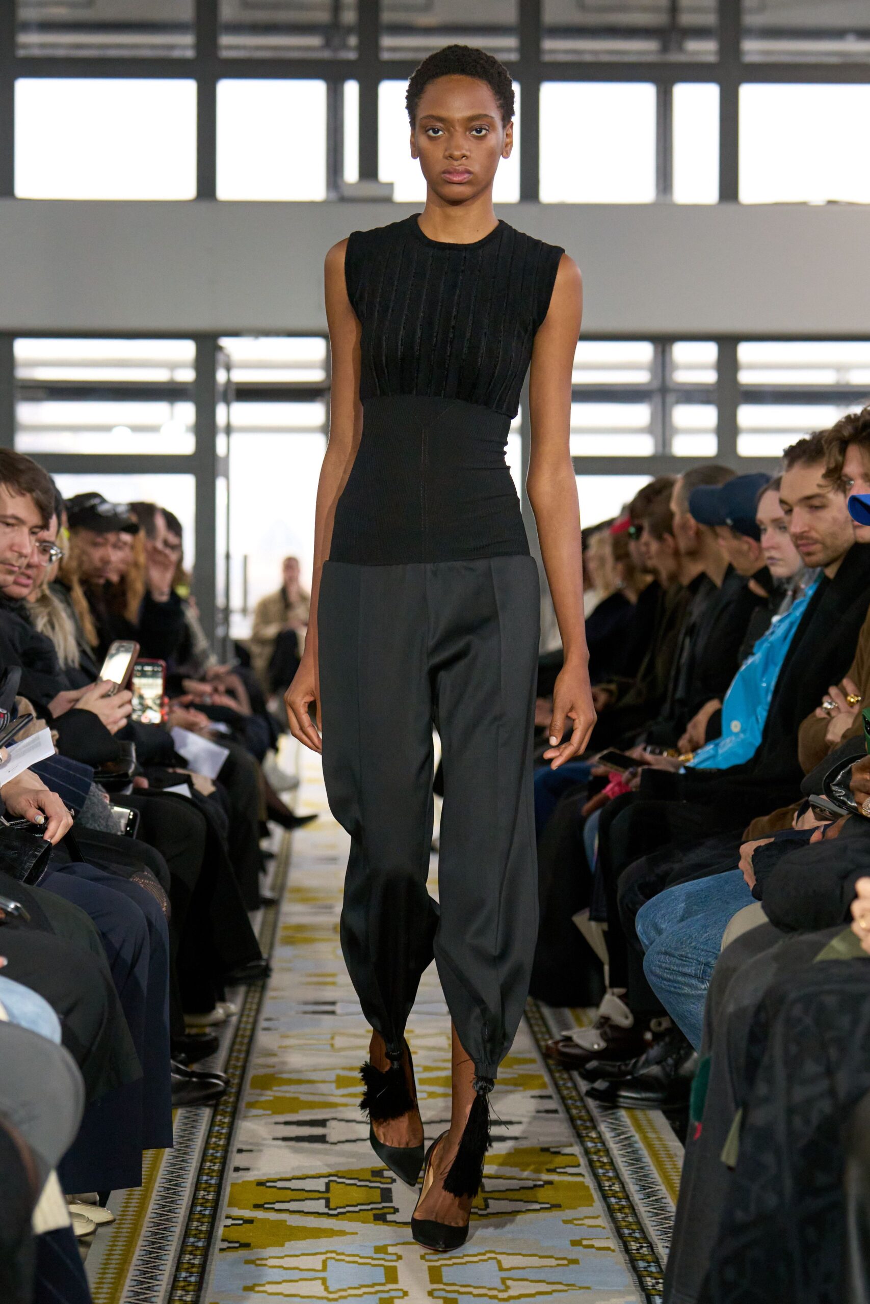 black fitted top and relaxed pants