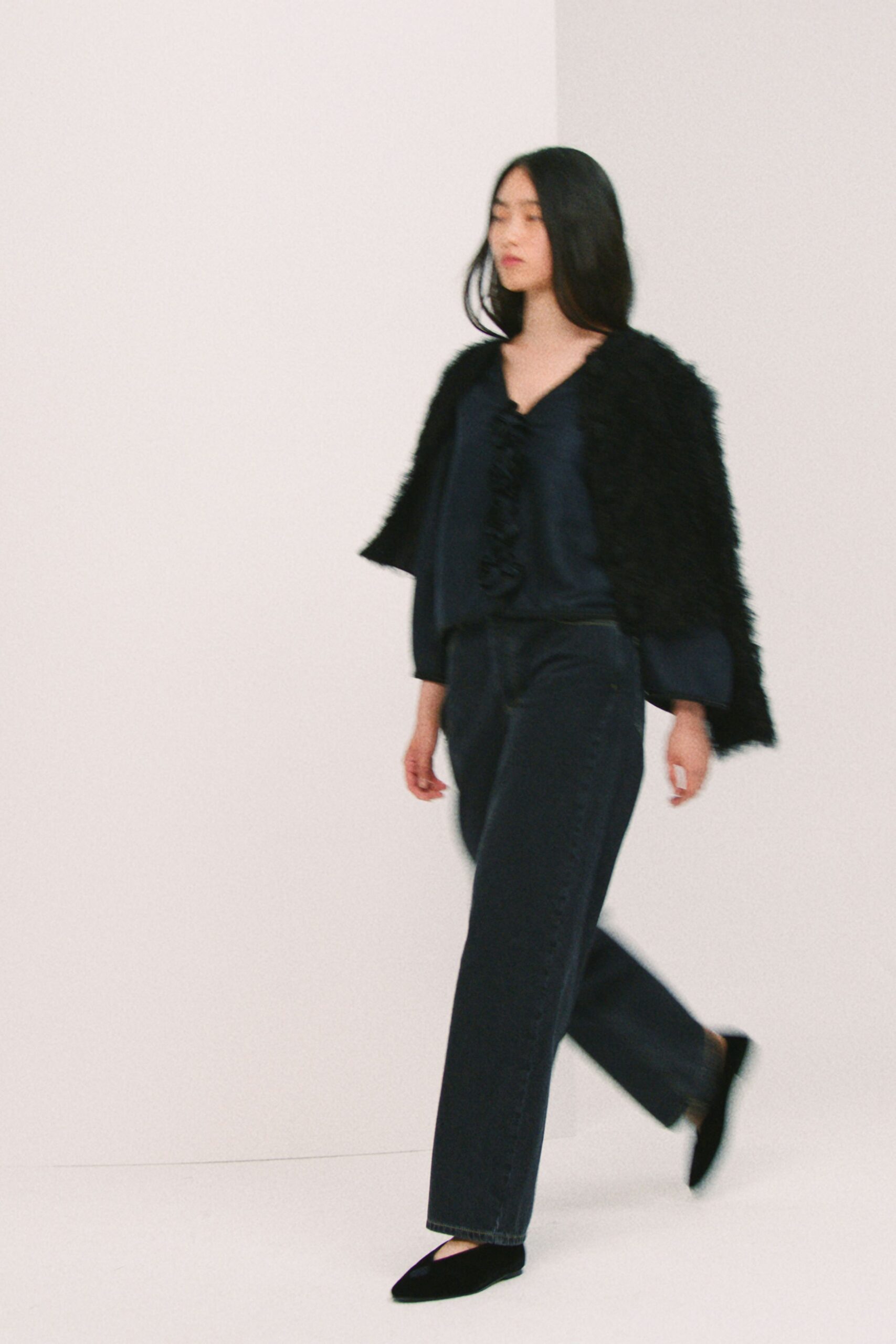 blue silk top with black coat