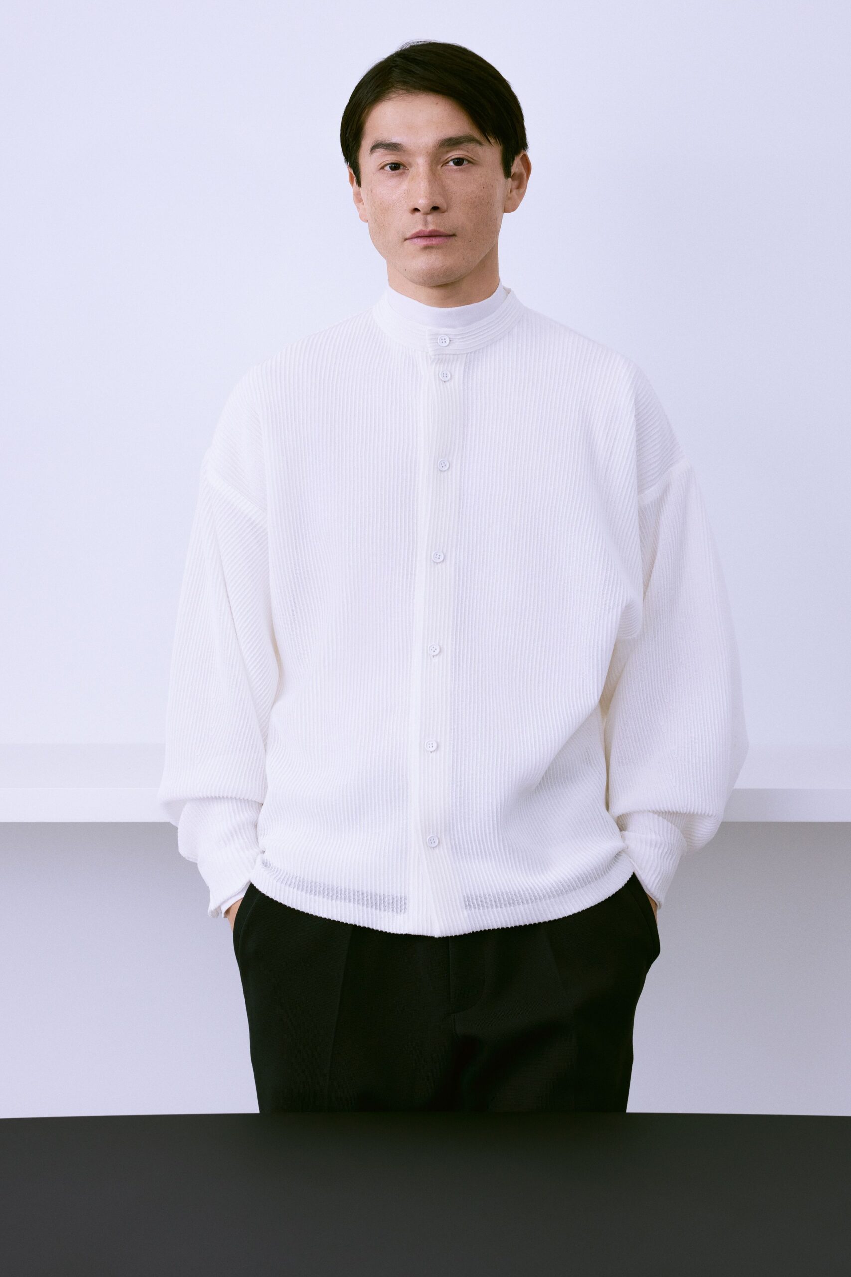 white relaxed shirt with black tailored pants