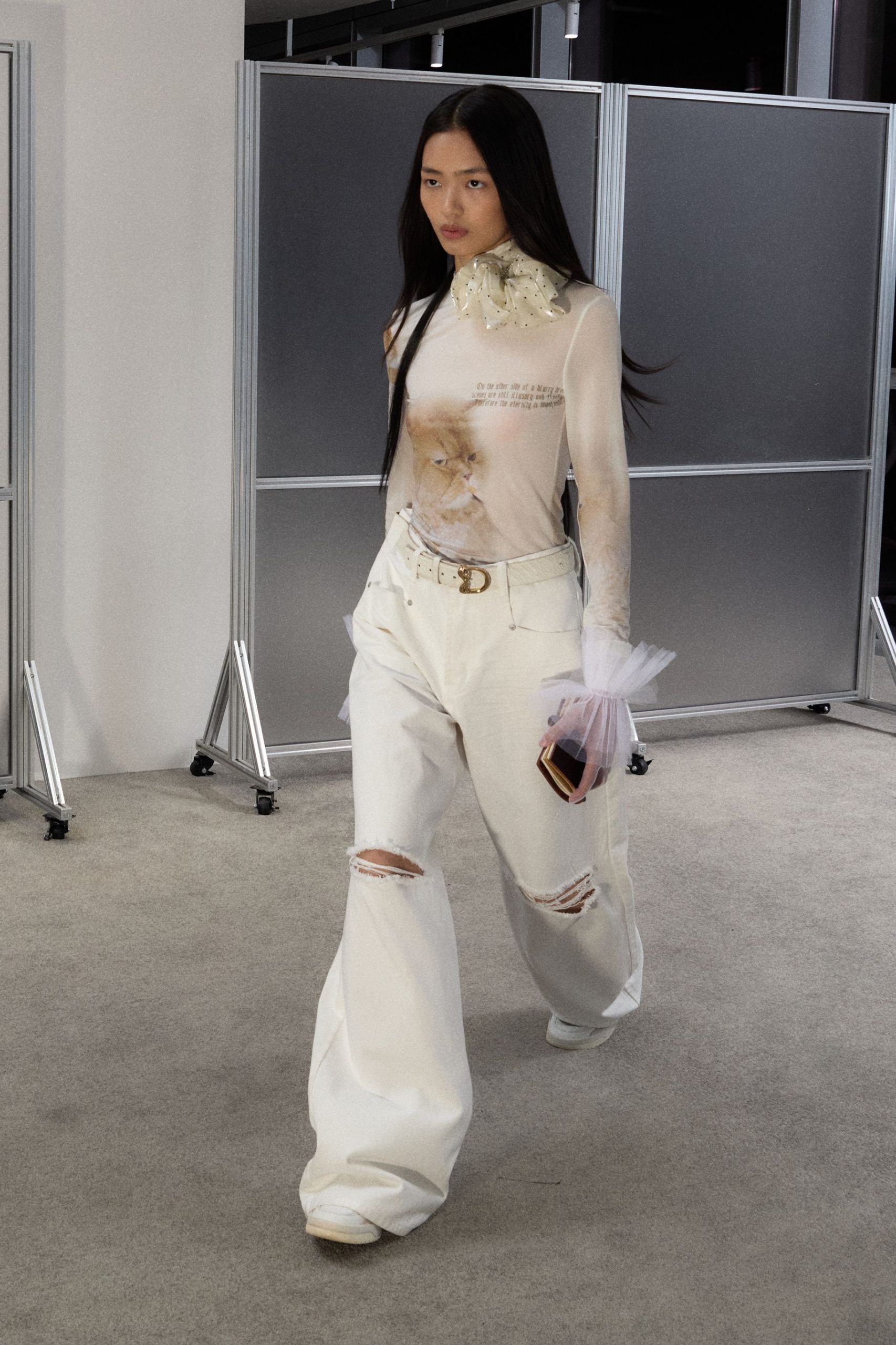 white fitted top with distressed pants