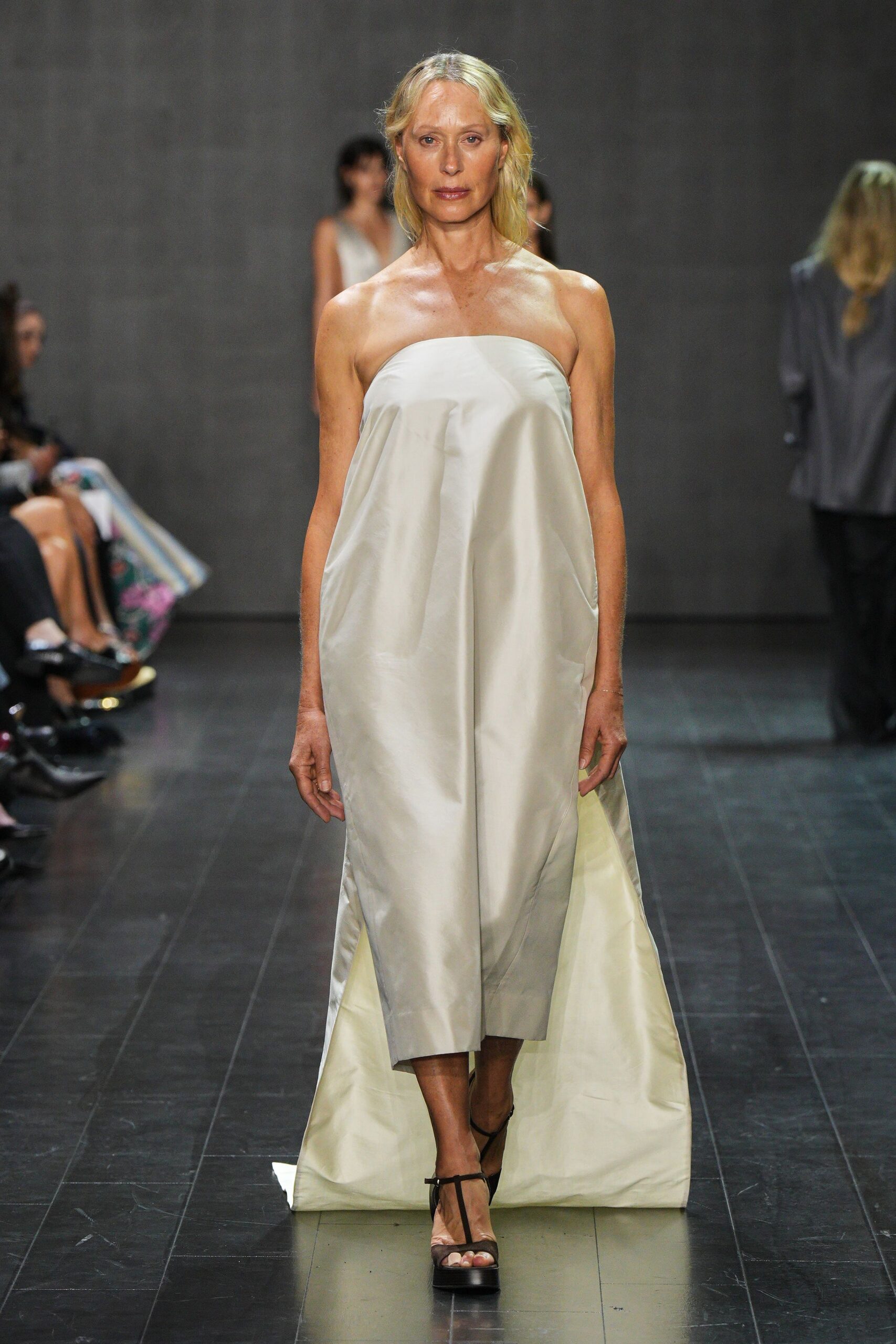 white satin strapless relaxed draped layered shiny dress