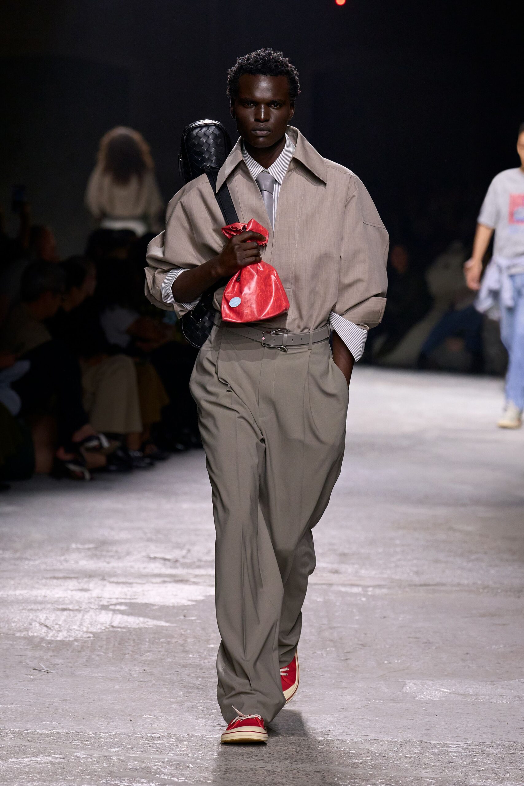 beige shirt gray pants red shoes
