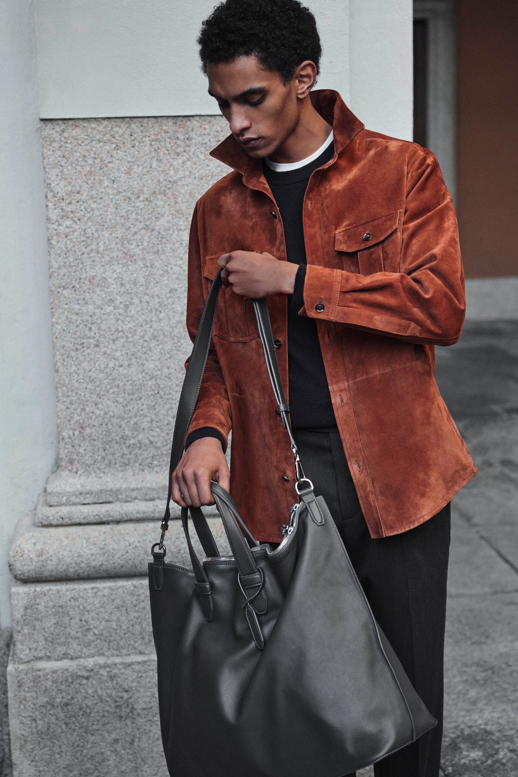 brown suede jacket with gray bag