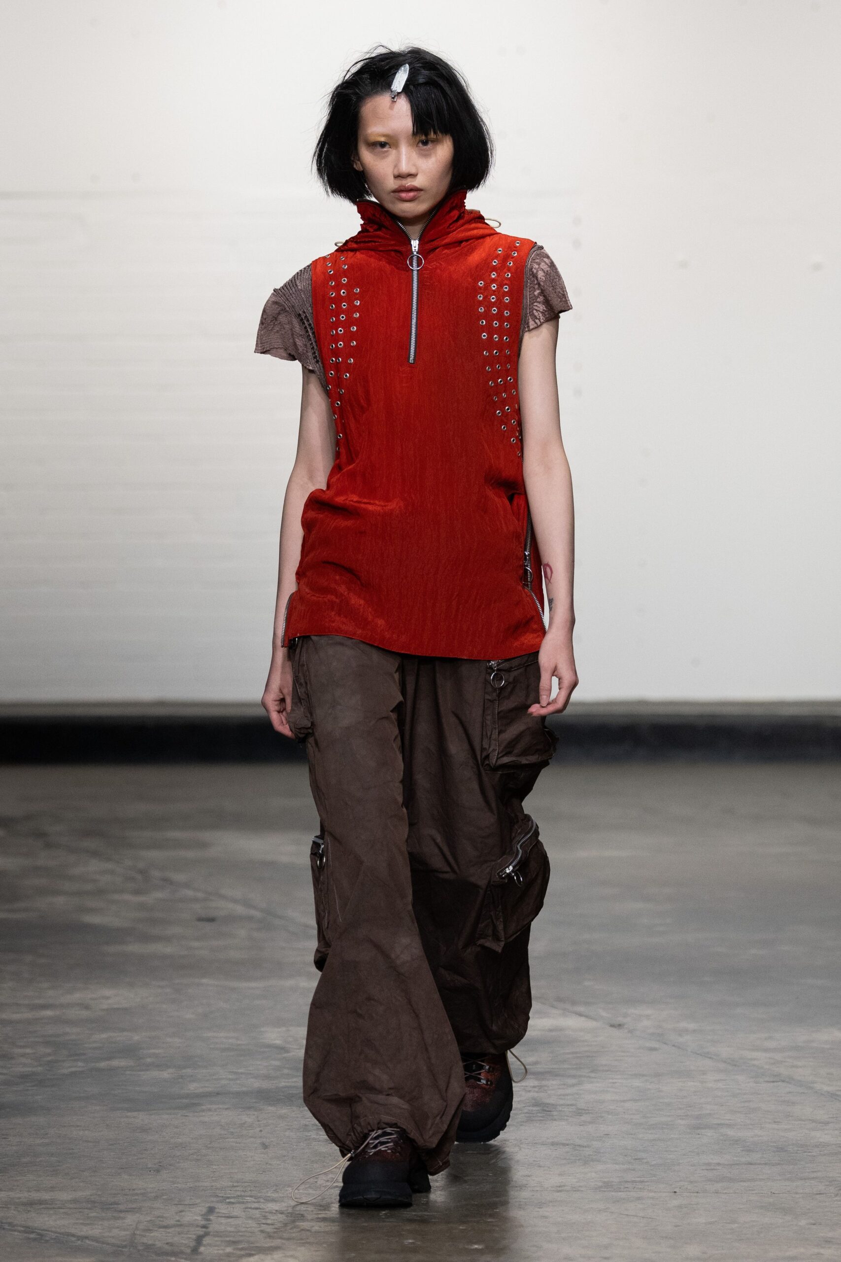 red hooded top with cargo pants