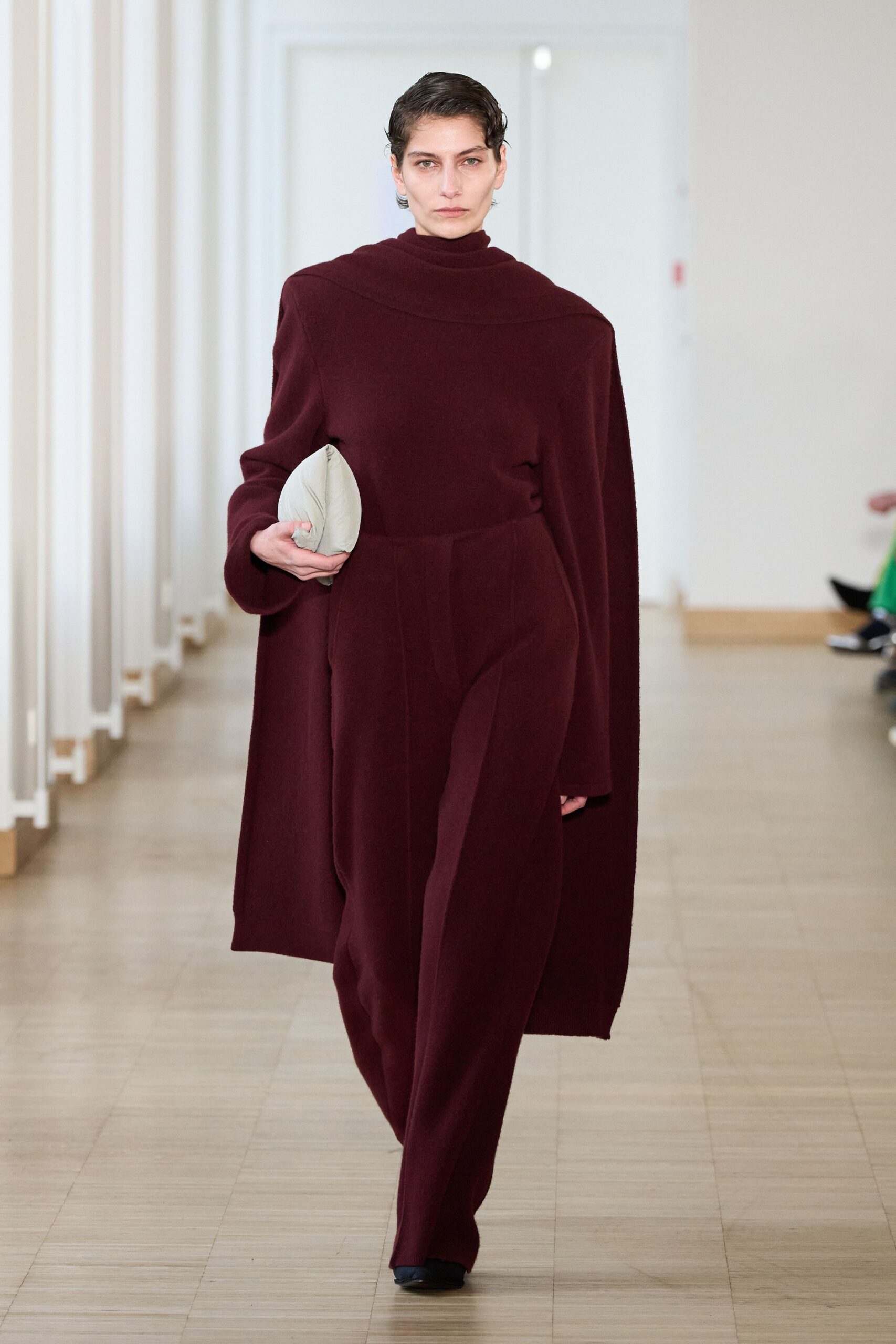 maroon wool long-sleeve high-neck fitted draped jumpsuit